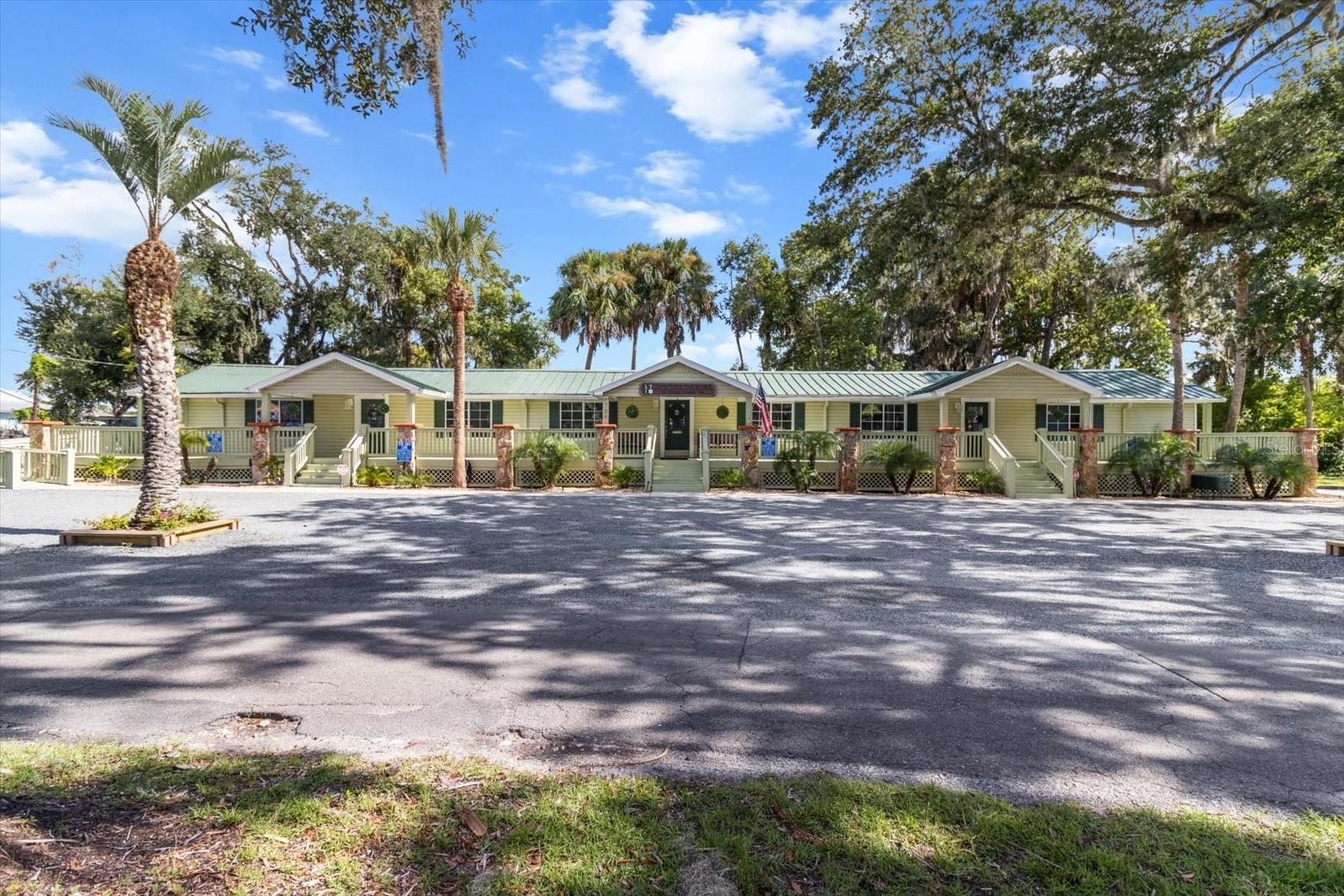 A unique downtown opportunity to own a piece of historical Crystal River. .75 acres at the corner of 1st & 4th Street. This Gem is located approximately two blocks from Hunter Springs and two blocks from the bay. This 2400 square foot office/condo has been modernized with two newer A/C units; new ductwork; and full insulation. The building has been refitted with CAT 5 wiring; an NEC SL 2100 phone system, as well as alarm system. The wrap-a-round porch is beautifully landscaped with indigenous Florida vegetation. The pervious rock parking allows for excellent drainage. With the property being 300x100, that gives you nearly 3/4 of an acre of prime downtown property. The property is divided into multiple addresses, suitable for business and/or residential. Firewalls separate the three rental units. Limitless possibilities for multiple uses!