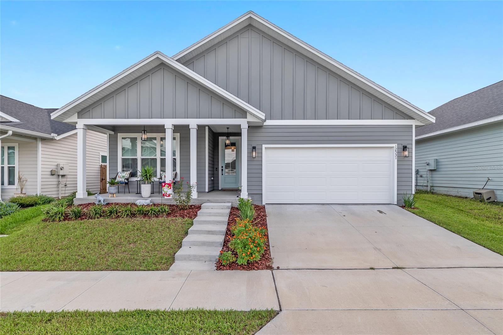 This almost-new three-bed, two-bath home in Alachua’s popular Savannah Station is move-in ready and packed with upgrades! Step inside to a bright, open layout with a stylish kitchen featuring stainless steel appliances, a spacious island, and plenty of storage for all your cooking needs. Out back, you’ll find a peaceful screened lanai leading to a 13’ x 13’ extended concrete patio — the perfect spot for barbecues, morning coffee, or sunset chats. The fully fenced backyard is perfect for weekend fun, while the whole-home surge protector gives you extra peace of mind. Located just minutes from local shops, dining, and a quick drive to Gainesville, this home blends comfort, convenience, and modern living.