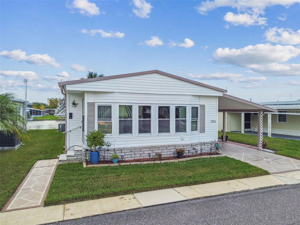 Photo of 3211 Southport Drive, Holiday, FL 34690 (MLS # TB8424509)