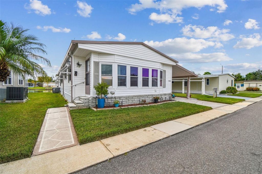 Photo of 3211 Southport Drive, Holiday, FL 34690 (MLS # TB8424509)