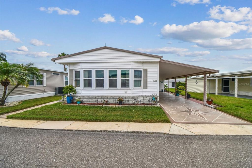 Photo of 3211 Southport Drive, Holiday, FL 34690 (MLS # TB8424509)