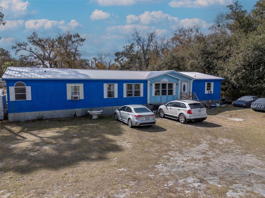 Photo of 6905 W Knights Griffin Road, Plant City, FL 33565 (MLS # TB8475849)