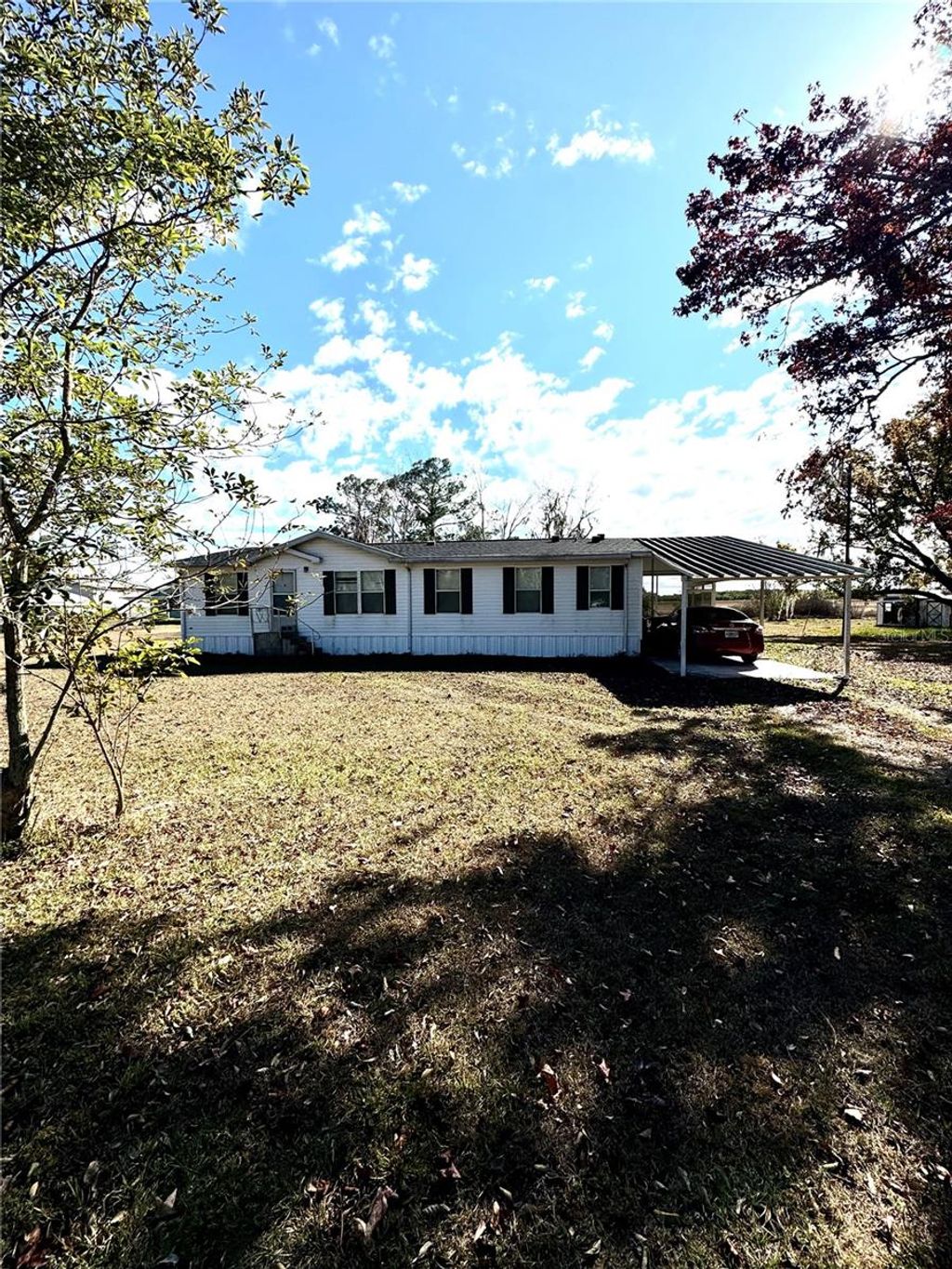 Photo of 112 Pine Tree Drive, Lake Placid, FL 33852 (MLS # O6378287)