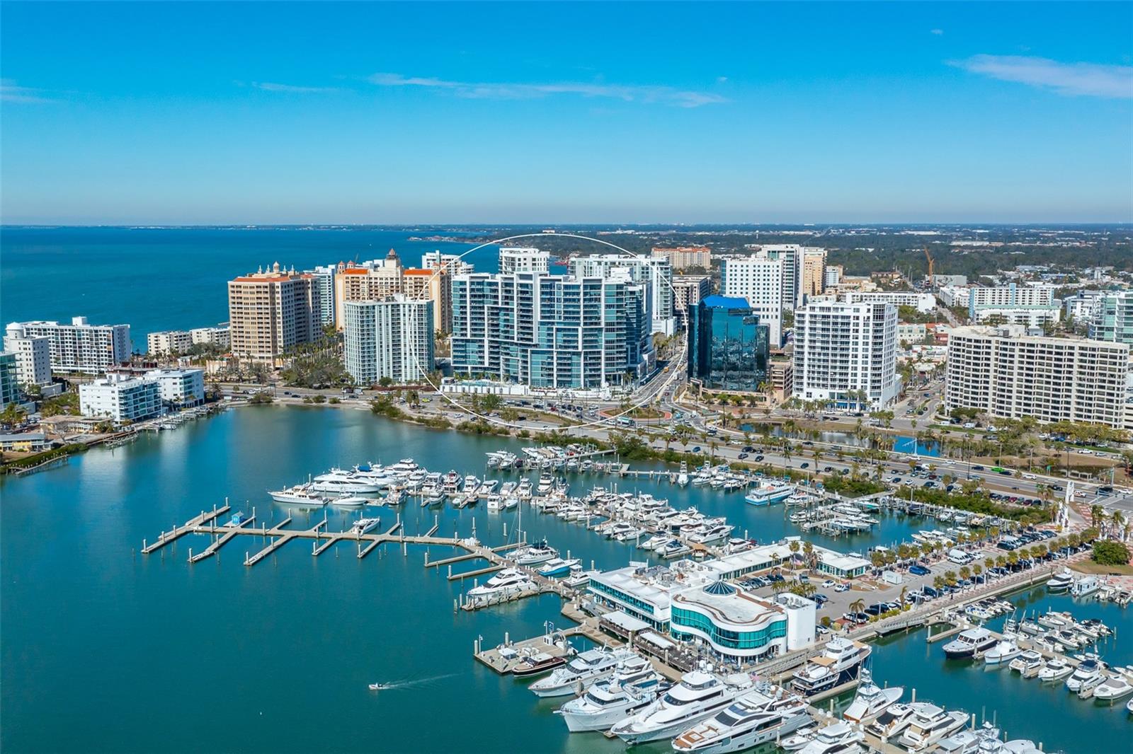 The modern elegance of VUE Sarasota Bay offers the perfect setting for year-round or seasonal waterfront living. Each unit provides an extraordinary waterfront lifestyle of breathtaking vistas of Sarasota Bay, Marina Jack, Big Pass and the Gulf of Mexico! Designed by the internationally acclaimed architectural firm Nichols Brosch Wurst Wolfe & Associates Inc., VUE showcases iconic architecture with floor-to-ceiling glass walls, open-concept living spaces and expansive terraces that seamlessly blend indoor and outdoor living. Residence #1406 features two bedrooms, two-and-a-half baths, a spacious den, a generously sized laundry room and an oversized terrace. Upon arrival, your private, access-controlled elevator opens directly into your personal foyer, where you’re immediately greeted by stunning interiors and breathtaking water and marina views. The residence is outfitted with 10-foot, full-height sliding glass doors and windows, maximizing natural light and panoramic vistas. The gourmet kitchen, complete with coffered ceilings, is equipped with a JennAir Euro-style stainless steel appliance suite, including a 42-inch built-in refrigerator, a 36-inch electric cooktop with stainless steel canopy hood, a 30-inch built-in microwave and convection double oven and a dishwasher. Residence #1406 also includes a climate-controlled storage unit (#98) and two assigned parking spaces (#158 and #159) located on the second floor of the garage — securely elevated over 30 feet above sea level. A recent sale of Unit #1606 (just two floors above) closed at $2,400,000, and it offers a smaller terrace than #1406. Don’t miss your opportunity to own this exceptional property and customize it to your taste! As for the building itself, an elevated lifestyle, safety and convenience are priorities at Vue Sarasota Bay. Residents enjoy 7,000 square feet of premier interior amenities, including a state-of-the-art fitness center, a formal lounge, a spacious clubroom, a daily coffee station, a club bar, a catering kitchen for private events, a business center, management offices, a resident boardroom and valet and concierge services. The outdoor pool deck overlooking Marina Jack is a serene retreat, featuring a heated pool, spa, private seating areas with fire pits and multiple gas grills, perfect for relaxing or entertaining friends. VUE Sarasota Bay fosters a strong sense of community, with a dedicated staff always on hand to meet residents' needs. With 24-hour security and valet parking available daily from 7 a.m. to 11 p.m., your comfort and peace of mind are top priorities. Built for safety and longevity, VUE was constructed with reinforced concrete beams, fireproofing and deep foundation pilings for added stability and security. It’s truly a fortress designed for modern living. Opportunities to own in this highly coveted building are rare, so act quickly! Schedule your private showing today and discover the unparalleled lifestyle VUE Sarasota Bay has to offer.