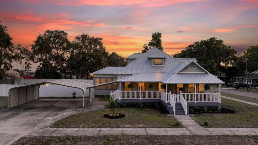 If houses could tell stories, this one would have a front porch full of them. Welcome to your very own 1920s home, where timeless character meets just the right amount of modern updates to make life easy. From the moment you step into that classic, straight-shot hallway, you can feel it… this home has personality. Not the cookie-cutter kind. The kind with history, charm, and details you just don’t see anymore. Think gorgeous white columns, tall baseboards, and detailed trim that frame each room like a piece of art. And then, layered in perfectly, you’ve got updated vinyl flooring flowing through most of the home, tying it all together in a way that feels fresh without taking away from the original soul. The layout gives you options… and lots of them. A formal dining room for holidays that turn into memories, a separate living room, and a bonus family room/den with a cozy wood-burning fireplace that practically begs for slow mornings or movie nights. The primary bedroom and second bedroom are conveniently downstairs, along with an indoor laundry room (because convenience matters), while the upstairs bedroom creates the perfect tucked-away guest space or private retreat. And let’s talk about the things you don’t have to worry about… because they’re already done. New windows (2017) bringing in all that natural light, a metal roof (2017), tankless water heater (2021), updated electrical touches, and more. The kind of updates that let you enjoy the home instead of constantly working on it. Now step outside, and this is where it really opens up. Sitting on a massive corner lot made up of three parcels, you’ve got room to breathe, host, play, garden… whatever your version of “home” looks like. And that additional finished building out back? It’s ready for your next idea… home gym, hobby space, media room, office… you name it. This isn’t just a house. It’s that rare mix of charm, space, and updates that’s getting harder and harder to find. And once you walk through it, you’ll understand exactly why.