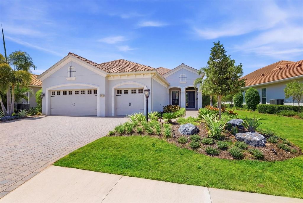 Photo of 7228 Whittlebury Trail, Bradenton, FL 34202 (MLS # A4693420)