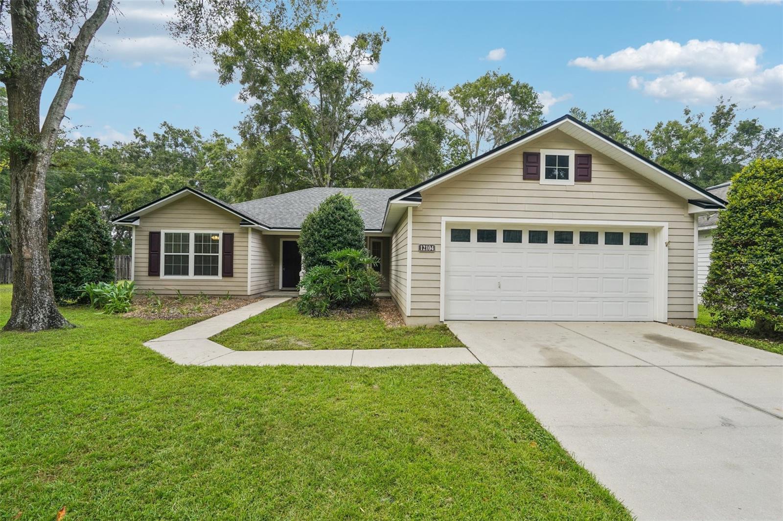 Welcome to this beautifully maintained 3 bedroom, 2 bathroom home in the sought-after Savannah Station community of Alachua! Nestled on a quiet cul-de-sac, this home provides peace, privacy, and a fully fenced backyard—perfect for pets, play, and entertaining. A brand-new roof (August 2025) ensures peace of mind for years to come, while the open floor plan with vaulted ceilings creates a light and airy feel throughout. The spacious primary suite features dual closets and a private bath, while the additional bedrooms are generously sized for family or guests. Enjoy a covered patio, landscaped yard, and a 2-car garage with extra storage. Conveniently located just minutes from downtown Alachua’s shops and restaurants, Publix, and quick access to I-75 for commuting. Only 20 minutes (approx. 16–18 miles) to the University of Florida and all the shopping, dining, and entertainment in Gainesville. With its unbeatable location, cul-de-sac lot, fenced back yard, new roof, and move-in ready updates, this home delivers the lifestyle today’s buyers are searching for. Don’t miss your chance—schedule your showing today!