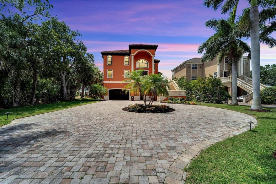 Under contract-accepting backup offers. Welcome to your dream Florida lifestyle! This stunning LUXURY home offers a breathtaking view of Sarasota Bay, where you can watch manatees and dolphins play right from your private balcony. With 4 spacious bedrooms, including a grand master suite with a spa-like ensuite bathroom and walk-in closet, this home delivers on luxury and comfort. The second bedroom also has a private bathroom and walk-in closet, while the 3rd and 4th bedrooms share a Jack-and-Jill style bathroom.

The open floor plan of the main floor is perfect for entertaining guests. The chef's kitchen boasts Subzero and Wolf appliances, and there's a breakfast/informal dinette that opens up to the large family room. You'll also find a formal dining room, powder room, office, study/gym room, and formal living room, all with stunning views of Sarasota Bay.

This meticulously maintained home comes with lifetime warranties on all Kohler plumbing fixtures, a 4-year-old HVAC, and an 11-year-old tile roof. The gorgeous landscaping surrounds a fenced-in saltwater pool with a sunbathing deck and spa. The property also leads to your private dock and lift for your boat, where you can fully appreciate the unobstructed views of Sarasota Bay.

This home is also designed with convenience in mind, featuring an elevator that takes you from the garage all the way up to your master suite. Located just 5 minutes from Sarasota Airport and 5 miles from downtown Bradenton and Sarasota, this property offers easy access to everything you need.

If you're a sports enthusiast, you'll be happy to know that IMG Academy, the world’s leading sports education brand, is located nearby. And if you love walking, riding your golf cart, or walking your dog in a safe area, this place has it all! With all of these amazing features, this home truly embodies the ultimate work-play-vacation lifestyle. Come see for yourself and make this your forever home!