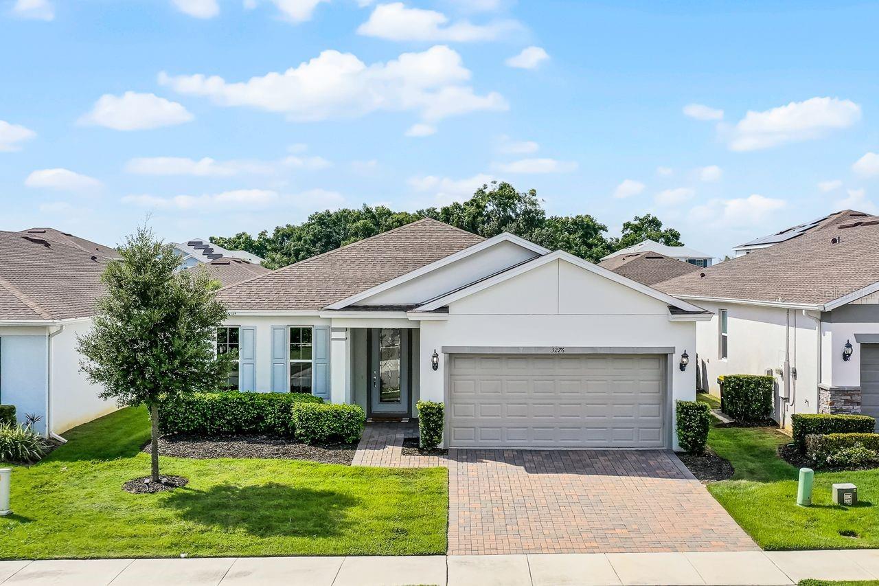 UPGRADES GALORE IN THIS SINGLE-STORY HOME! Three large bedrooms plus a flex room! This open floorplan Lakeview Preserve home is loaded with modern, upgraded features, such as LUXURY VINYL flooring throughout the living space. At the front of the home, there is a large FLEX ROOM that is perfect for an office, study, or game room. Moving down the entry hallway, the home opens onto the spacious kitchen, with clean white cabinetry, slick quartz countertops, and HUGE ISLAND for prepping and entertaining. The living space is accented by a sophisticated SHIPLAP WALL, tray ceiling, and large sliding glass door with views to the tranquil outdoor space. This split floorplan positions the large primary suite off the living space at the rear of the home for added privacy. It features a large WALK-IN CLOSET and primary bathroom with dual sink vanity and glass WALK-IN SHOWER. The two guest bedrooms are in their own wing at the front of the house, sharing their own guest bathroom. Stepping outside, you are greeted with a large covered and screened patio that features a rear ROLL-UP SCREEN, allowing for ultimate indoor/outdoor living. The gated Lakeview Preserve community features a RESORT-STYLE COMMUNITY POOL, children’s splash pad, outdoor cabana, stylish clubhouse with fitness center, and playground - PLUS a waterfront community dock and kayak launch on Johns Lake. The location is prime, with easy access to SR-429, US-27 and FL Turnpike making commuting a breeze. Also enjoy a quick drive to local shopping, dining, and entertainment destinations like Downtown Winter Garden, Winter Garden Village shopping center, Downtown Clermont, Walt Disney World, Universal Orlando, and more. This home is your next Florida oasis, schedule your private showing today!