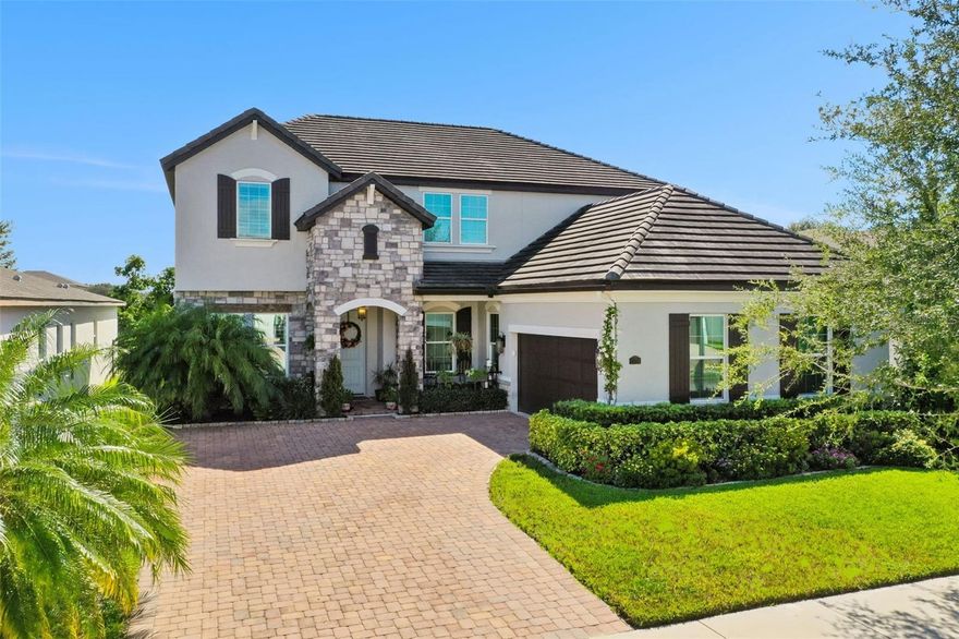Welcome to this stunning architectural masterpiece nestled in the heart of Twinwaters, one of Winter Garden’s most sought-after communities. This elegant two-story home seamlessly blends sophistication and comfort, offering over 3,600 square feet of beautifully designed living space.

Step through the grand entryway to find soaring ceilings, expansive windows that fill the home with natural light, and designer finishes that exude contemporary luxury. The gourmet chef’s kitchen is a true showpiece—featuring 42” custom cabinetry, gleaming quartz countertops, a massive entertainment island, stainless steel appliances, and a walk-in pantry, perfect for culinary enthusiasts and family gatherings alike.

The open-concept great room flows effortlessly into a spacious dining area and covered lanai, ideal for both indoor and outdoor entertaining. Upstairs, the luxurious primary suite offers a serene retreat with dual walk-in closets, a spa-inspired bathroom with a deep soaking tub, frameless glass shower, and dual vanities.

A versatile loft provides additional space for a home theater, gym, or play area, while the first-floor guest suite ensures comfort and privacy for visitors. The private backyard invites you to create your own oasis—whether adding a pool, summer kitchen, or lush garden escape.

Enjoy resort-style amenities including a community pool, playground, and picturesque walking trails, all surrounded by pristine lakes and lush landscaping. Twinwaters is ideally situated near Horizon West, top-rated schools, fine dining, boutique shopping, and major highways for an easy commute to downtown Orlando and world-famous attractions.

This home truly embodies the ultimate blend of luxury, location, and lifestyle—a rare opportunity to live beautifully in one of Central Florida’s premier communities.