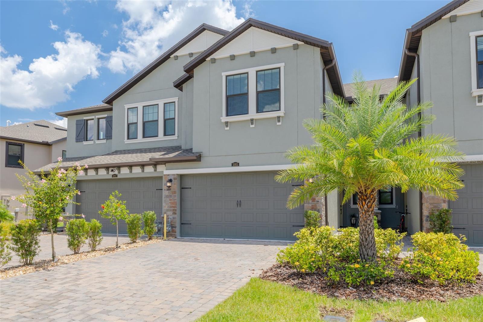 Live where luxury meets lifestyle in this stunning 2023 Sofia townhome, one of the newest constructions in the award-winning Estancia community of Wesley Chapel. This pristine 3-bedroom, 2.5-bath home shows like new and offers 1,827 sq. ft. of thoughtfully designed space with a flexible loft area and oversized 2-car garage with extra storage. From the moment you arrive, thoughtful details shine throughout this open-concept layout that flows seamlessly from the expansive great room to a chef's dream kitchen featuring elegant quartz countertops, a large prep-and-gather island, soft-close cabinetry with pull-out shelving, and premium stainless steel appliances including a gas range with sleek vent hood. Quality upgrades include custom walk-in closet systems, energy-efficient tankless water heater, and WATER SOFTENER system for enhanced comfort. Escape to the tranquil primary suite featuring a spacious layout that easily accommodates a king-size bed, along with a spa-style ensuite bath boasting dual vanities, a generous walk-in shower, private water closet, and an oversized walk-in closet with separate linen closet. Upstairs you'll find two additional well-appointed bedrooms with ample space and a large laundry room for ultimate convenience. Extend your living space to the private covered lanai perfect for morning coffee or evening relaxation, where the seamless flow from kitchen to outdoor space makes entertaining effortless whether hosting intimate gatherings or larger celebrations. Living in Estancia means embracing a vibrant lifestyle with resort-caliber amenities just steps from your door including two stunning pools with heated zero-entry pool featuring lap lanes and slide, state-of-the-art fitness center, luxury clubhouse with community events, tennis and pickleball courts, basketball court, playground, dog park, and 11 miles of scenic walking trails through beautifully landscaped grounds. The HOA handles exterior maintenance, landscaping, irrigation, and roof reserves ensuring truly low-maintenance living so you can focus on enjoying your new lifestyle. Perfectly positioned just minutes from Wiregrass Mall, AdventHealth Wesley Chapel, top-rated schools with bus transportation, and abundant dining options, with easy I-75 access putting you less than 30 minutes to downtown Tampa and within reach of Florida's premier beaches and attractions. This is more than a home, it's your gateway to the best of Florida living in Wesley Chapel's most desirable community. Don't miss this rare opportunity to own one of the newest homes in Estancia at Wiregrass Ranch where luxury meets lifestyle. Schedule your private showing today and discover why this exceptional townhome delivers the perfect blend of modern sophistication, resort-style amenities, and prime location convenience.