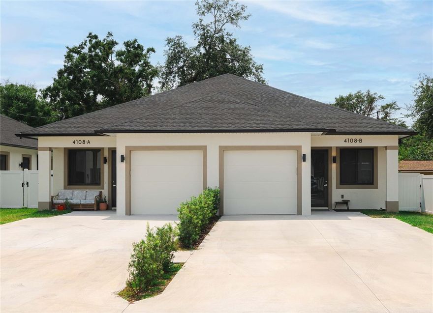 Under contract-accepting backup offers. Turnkey Tenant-Occupied Duplex – 2024 Construction in High-Demand Drew Park Investor-ready and fully leased! This 2024-built duplex in Tampa’s centrally located Drew Park offers immediate cash flow with existing tenants in place. Each unit features a modern 3-bedroom, 3-bath villa layout with a 1-car garage—designed to appeal to today’s renters seeking privacy and functionality. Each spacious bedroom includes its own private en-suite bathroom, significantly boosting rental potential, especially for shared living or student housing scenarios. The open-concept layout includes a contemporary kitchen with island seating, abundant cabinetry, and a complete set of brand-new stainless steel appliances: French door refrigerator, smooth-top range, dishwasher, and microwave hood. Additional investor-friendly highlights: Fully fenced backyards and parking for 3 vehicles unit Washer/dryer hookups in each garage Modern finishes throughout Water, sewer, trash, and lawn care included in rent Tenants benefit from an optional Resident Benefits Package (utility concierge, filter delivery, maintenance portal) Located just steps from Hillsborough Community College and close to Tampa International Airport, International Plaza, and major highways, this property is ideally positioned in one of Tampa’s most active rental markets. This is a low-maintenance, opportunity perfect for investors seeking immediate returns and long-term growth in a prime location.