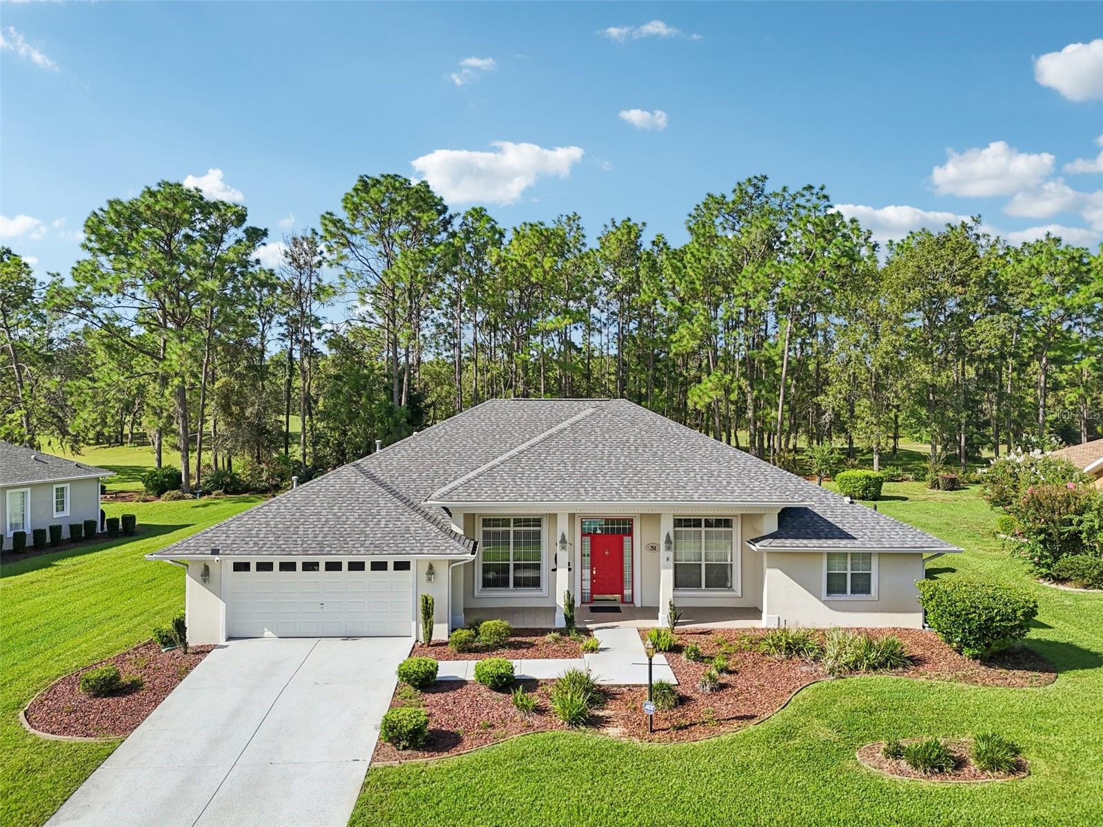 Welcome to 31 Lake Diamond Drive—where comfort and charm come together This SPACIOUS 4-bedroom, 2-bathroom home with 2,182 sq. ft. is move-in ready with a BRAND-NEW ROOF (2024) and an HVAC only a few years old—giving you peace of mind for years to come. Step inside through the welcoming foyer and you’ll instantly notice the BRIGHT, OPEN FLOOR PLAN that flows effortlessly for gatherings with family and friends. The SPLIT-BEDROOM LAYOUT offers privacy, while FRESHLY PAINTED walls in a MODERN NEUTRAL PALETTE create the perfect backdrop for your personal style. You’ll love the details—double crown molding, a coffered ceiling in the primary retreat, granite counters in the kitchen, built-in features in the office/den, and new luxury vinyl plank flooring in the bedrooms. But the true showstopper? A sparkling SALTWATER, SOLAR HEATED POOL with a huge screened enclosure and OUTDOOR KITCHEN, designed for year-round enjoyment. Outside, the OVERSIZED LOT delivers serene views of Florida’s lush trees—your own private sanctuary. And just beyond the woods, you’ll catch glimpses of the 18th hole of Lake Diamond Golf & Country Club, blending peaceful living with a golfer’s dream. Don’t miss this rare opportunity to own a pool home on one of the community’s most desirable lots. Schedule your private showing today and see why 31 Lake Diamond Drive is the perfect place to call home!