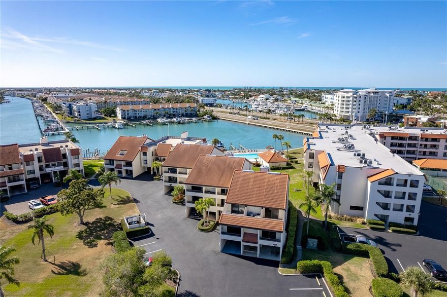 Welcome to 120 1st Street E, Apt 108 in Tierra Verde, a coastal townhome that feels easy, comfortable, and perfectly in tune with the Florida lifestyle. Located in the sought-after Village at Tierra Verde, this three-bedroom, three-bath home offers space, flexibility, and water views in a community people truly love living in.  This home sits high and dry, never flooded!

One of the most appealing features is the ground-floor suite, which works beautifully as a primary bedroom, guest space, in-law suite, or even a quiet home office. It’s a layout that adapts to real life, whether you’re hosting visitors, working remotely, or planning long-term living.

The main living area has been recently updated with luxury vinyl plank flooring and a refreshed kitchen that opens to the living and dining spaces, making it comfortable for everyday living and easy entertaining. Multiple balconies extend the living space outdoors, offering peaceful water views and coastal breezes that remind you why you chose Tierra Verde in the first place.

Upstairs, the attic flex space adds even more versatility. It’s ideal for a media room, home office, workout space, or creative studio—extra room that makes a noticeable difference in how the home lives.

The Village at Tierra Verde offers a relaxed, waterfront setting with access to a community pool and boat dock, making it easy to enjoy the water without leaving your neighborhood. The grounds are well cared for, the pace is calm, and there’s a genuine sense of community that keeps residents here for years.

Tierra Verde is known for its island feel, boating lifestyle, and unbeatable location. Fort De Soto Park, with its award-winning beaches and trails, is just minutes away, and downtown St. Petersburg is close enough for dining, arts, and entertainment without sacrificing peace and quiet at home. Whether you enjoy boating, biking, kayaking, or simply watching the sunset, this area delivers a lifestyle that feels relaxed and authentic.

120 1st Street E, Apt 108 is ideal for someone looking for a well-designed coastal home in a community that values water, space, and everyday enjoyment. It’s the kind of place where life feels a little slower, weekends last longer, and home truly feels like a retreat.