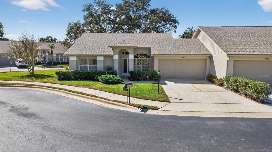 Welcome to this beautifully maintained 2 Bedroom, 2 Bathroom End-Unit Villa in the desirable 55+ community of Nature's Cove at Highland Lakes! One of the unique things about this particular villa, is it is on an oversized lot of 7,645, where other villas in Nature's Cove are much smaller. This bright split floor plan features bay windows in the kitchen and primary bedroom, a spacious primary suite with dual sinks and a large walk-in closet, plus major updates including a new roof (2024), HVAC (2020), and hot water heater (2014). The large 2-car garage offers excellent storage. Highland Lakes is an exceptional 55+ golf community offering 3 private 9-hole courses with unlimited free play, two clubhouses, Olympic sized pool, tennis, pickleball, a wood shop, craft rooms, and more. The Lodge on Lake Tarpon provides an additional pool, whirlpool, fireplace, veranda, and pontoon boat cruises,all included. Secured on-site storage is also available for boats, jet skis, and RVs. Master HOA is $164/month: Clubhouses, pools, 3 golf courses. Nature's Cove is $205/month: Landscaping, trash, cable TV & internet totaling $369 per month.  Enjoy maintenance-free living and a vibrant active lifestyle! Schedule your tour today!