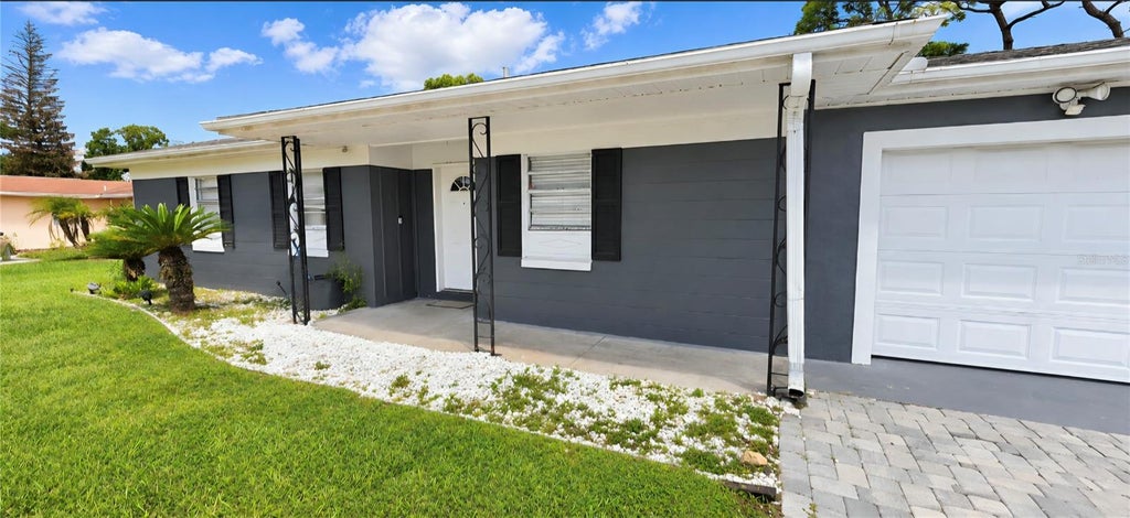 Photo of 8007 Meadowglen Drive, Orlando, FL 32810 (MLS # O6452048)