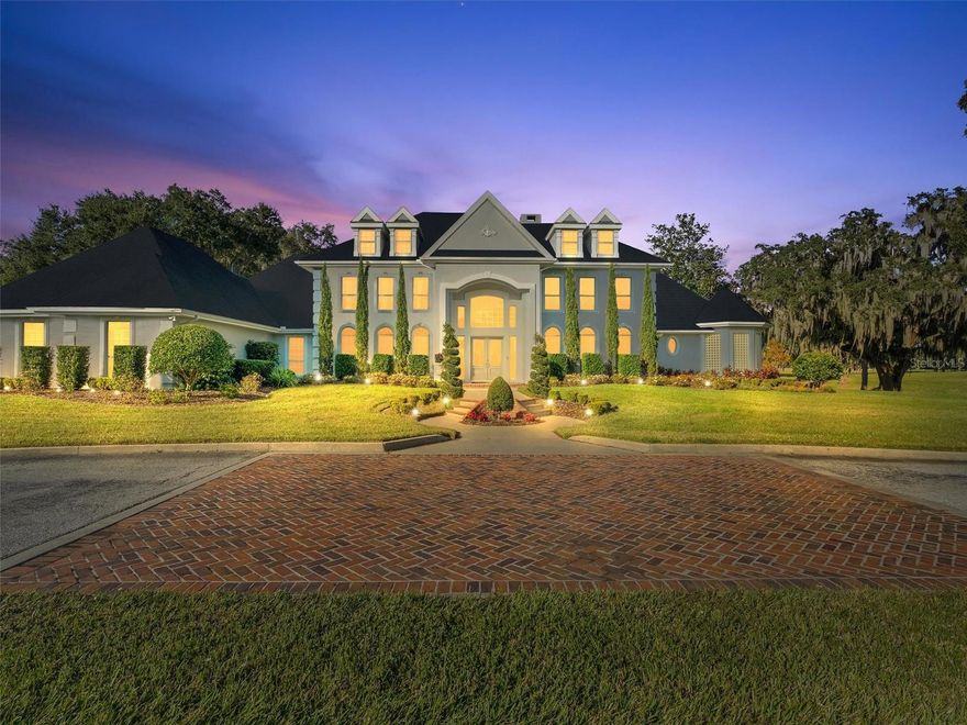 Magnificent 30 acre, manicured estate with stunning 7,456 square-foot main house that boasts seven bedrooms, six and one half baths, three car garage, with exquisite details at every turn in this one of a kind property in Silverleaf Hills. Marble flooring, granite counter-tops and crystal chandeliers adorn this impressive estate home with lake frontage, swimming pool, boat dock with lift and boat storage; and extensive/lighted landscaping and entertainment areas.. The home includes soaring ceilings throughout; a library, workout/massage room and massive third floor storage rooms to store your seasonal decorations. Rolling hills lead to the 1700 SF, three bedroom, two bath lakefront guest cottage. This farm was designed using first-class construction for the efficient management of one of the finest horse breeding programs in the country, as well as the stunning architecture of the former Silverleaf Horse Farm with grand cupolas throughout the farm . The absolutely magnificent stallion barn includes a grooming station, office, observation deck, laboratory, bathroom, small 42' X 48" indoor arena with shock absorbing footing for mild exercise and viewing; large equipment room, wash rack and and entertainment areas. Each stall is built with concrete block covered with 1/2 wood walls for safety and noise reduction. It is just a short walk to the equally impressive mare barn with ten stalls, includes a lab, office, kitchenette, impressive billiards room, tack and feed rooms, 1.5 bathrooms, grooming station and storage area. The two spacious paddocks provide ample space for grazing and training. This is the opportunity to purchase your part of equine history! The estate is located in the newly developed Silverleaf Hills Estates, a gated 768+ acre equine community of spring fed lakes, majestic oaks, rolling hills and picturesque homesites. Only 90 minutes to the Tampa or Orlando Airport and only minutes to the shopping, medical, and entertainment in The Villages or Ocala, Florida. Call for your appointment and tour of this estate.