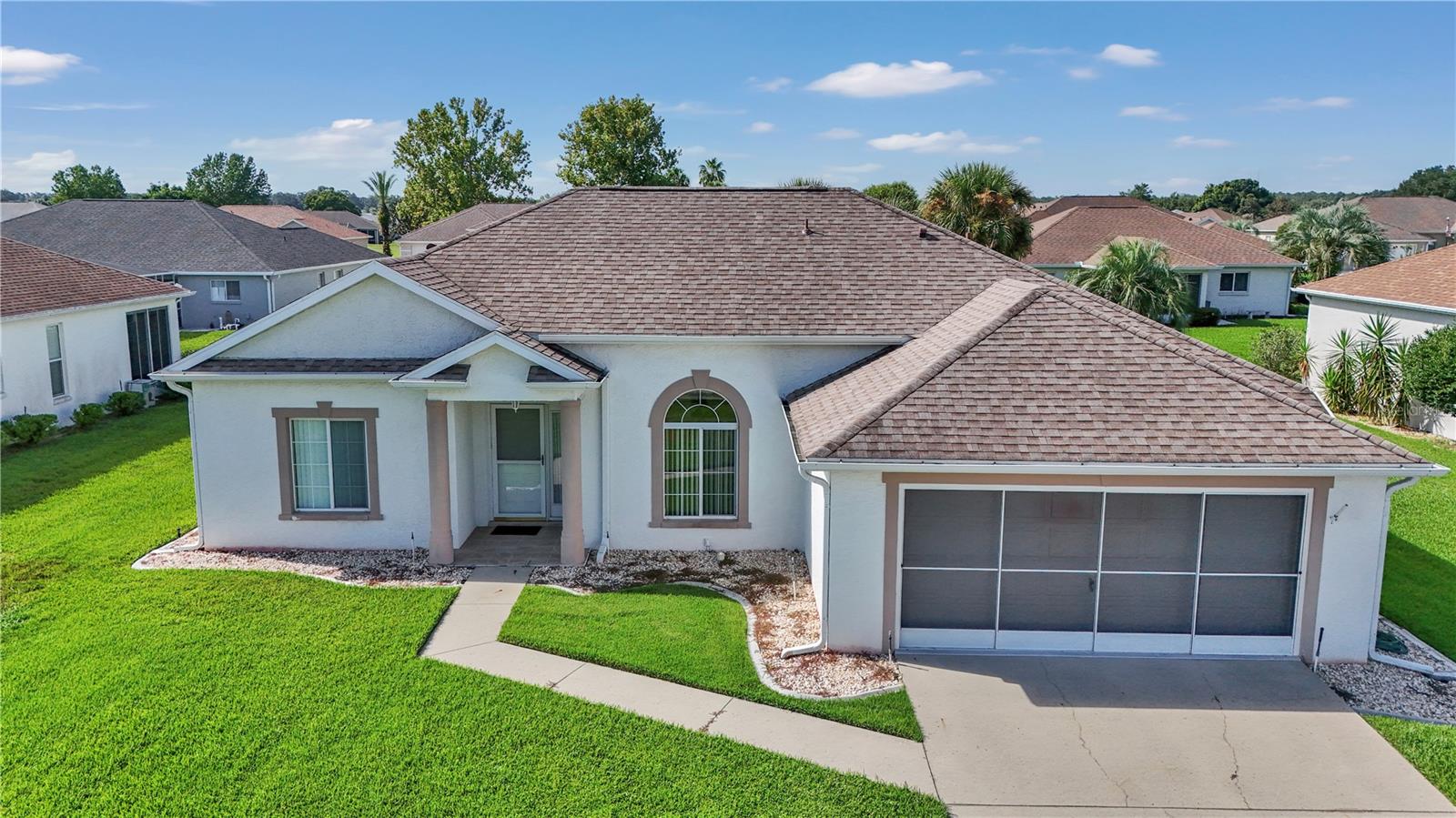 Check out this well-maintained, move-in-ready home in the desirable 55+ gated golf community of Ocala Palms! Offering over 1,500 sq ft of living space, this 3-bedroom, 2-bath home features tile flooring throughout the main traffic areas, an updated master bathroom, and a sunroom perfect for relaxing or entertaining. Throughout the home, natural light pours in from window to window! The master suite also includes a walk-in closet for ample storage. Key updates include a new roof (2017) and HVAC (2017) for peace of mind. Additional features include a garage with built-in shelving/storage and an irrigation system. Located close to the main clubhouse and just minutes from shopping, dining, medical services, and the World Equestrian Center. Buy now and gain instant equity! This is the perfect place to plant roots and enjoy the Florida lifestyle. Come see it today!