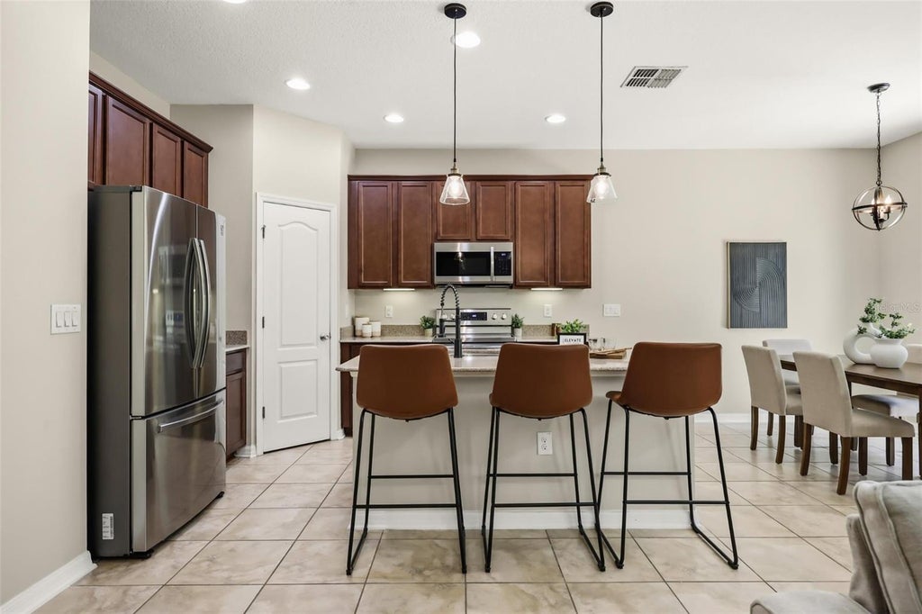 Photo of 215 Lakes Shore Drive, Davenport, FL 33837 (MLS # O6437367)