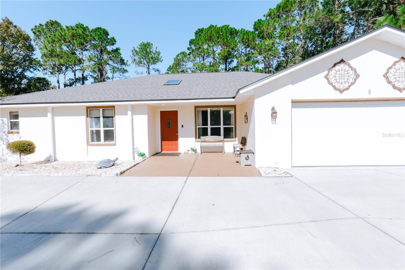 Stunning pool home for sale in Palm Coast! This is truly the entertainers masterpiece with added privacy! Enjoy the large screened in pool with a very spacious backyard patio next to undeveloped land. The kitchen features an open-floor plan to the living room and is fully upgraded with granite countertops, custom cabinets, and stainless steel appliances! Feel at ease with a nearly brand NEW ROOF. Observe and enter the beautiful backyard from 2 large sliding doors throughout the home and French doors from the kitchen! Enjoy a roundabout driveway with a 2-car garage! Within very close proximity to major grocery shores and restaurants! There are so many lovely features about this home! Come view 8 Palmer Ln today and fall in love!