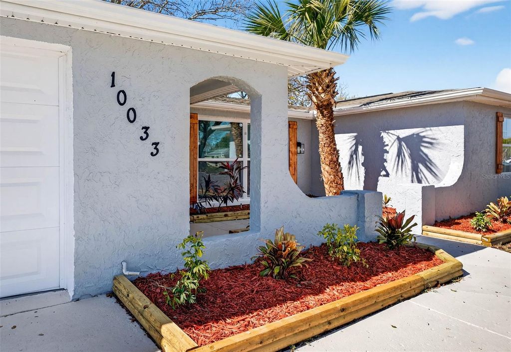 Photo of 10033 Regency Park Boulevard, Port Richey, FL 34668 (MLS # TB8474887)