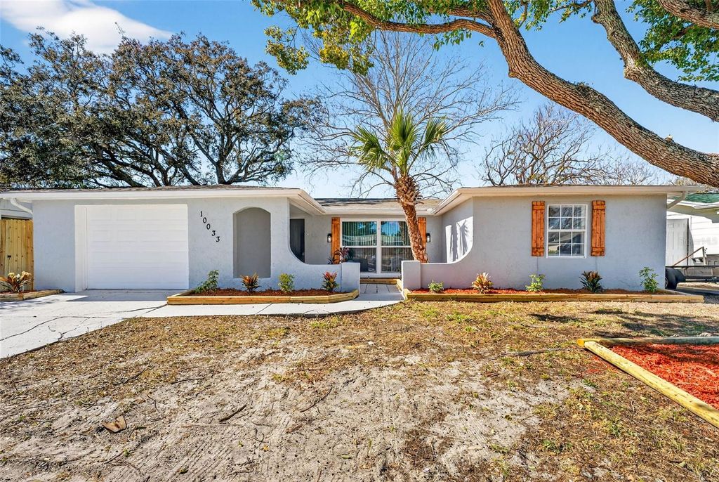 Photo of 10033 Regency Park Boulevard, Port Richey, FL 34668 (MLS # TB8474887)