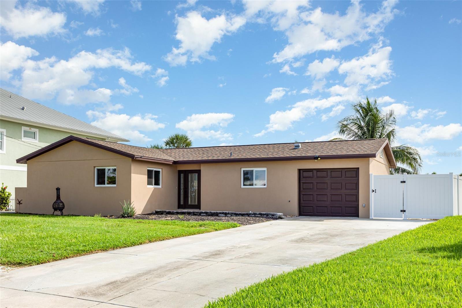 Some photos have been virtually staged. Welcome to Bay Colony, a sought-after waterfront community nestled along the deep-water canals of Terra Ceia Bay. This beautifully updated two-bedroom, two-bath residence with a flex room and one-car garage combines timeless finishes with modern conveniences in a prime location.
Ideally situated between St. Petersburg and Sarasota, the community offers quick access to I-275, I-75, US-41, and US-19. Within just 30 minutes, you’ll reach world-class dining, shopping, cultural events, and Gulf Coast beaches.
Inside, the home showcases a bright and open floor plan where the living and dining areas flow seamlessly together—perfect for both everyday living and entertaining. Luxury vinyl plank flooring extends throughout, providing durability and style.
The chef’s kitchen is a standout, appointed with shaker cabinetry, quartz countertops, a deep farmhouse sink, stainless steel appliances, and a natural gas range. A spacious walk-in pantry provides exceptional storage and organization.
A sun-filled Florida Room with expansive windows and French doors opens to the back patio and yard, offering a versatile space for lounging, entertaining, or simply enjoying the view.
The primary suite features abundant closet space, natural light, and a beautifully updated ensuite bath with a quartz-topped vanity and walk-in shower. A private flex space off the primary bedroom is ideal for a studio, nursery, or fitness room. A second bedroom and full bath, located across the hall, provide comfort and privacy for guests. The secondary bath includes a pedestal sink, full-size soaking tub, and built-in storage.
For boating enthusiasts, this property is truly special. A 27’ SeaRay boat conveys with the home, resting on a 12,000-lb lift. The composite dock, complete with water and electricity, makes waterfront living effortless. Spend evenings exploring the waterways and taking in breathtaking Florida sunsets—all from your own backyard.
Don’t miss the opportunity to make 5108 Commonwealth Rd your new home. Schedule your private showing today!
