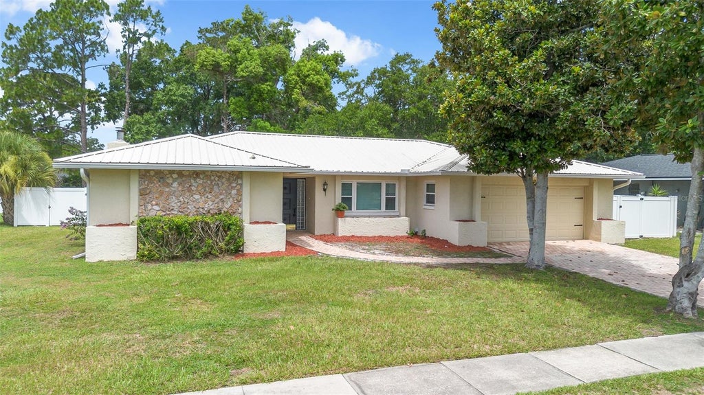 Photo of 8208 Tansy Drive, Orlando, FL 32819 (MLS # O6425213)