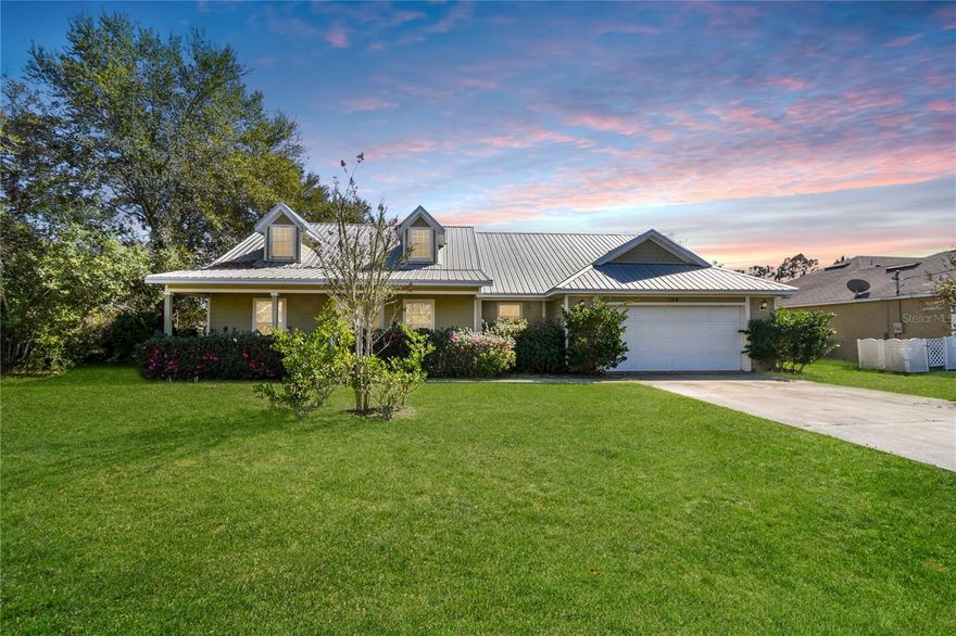 Move-in ready cottage-style home on an oversized lot in Palm Coast’s desirable U community with NO HOA or CDD fees. Featuring Cape Cod–inspired dormers, an inviting front porch, and beautiful curb appeal, this 3-bedroom, 2-bath home offers warmth and character that’s hard to find in today’s cookie-cutter new construction.

Inside, you’ll find a desirable split floor plan with a spacious living room centered around a cozy fireplace, creating the perfect gathering space for relaxing or entertaining. The home has been freshly painted throughout with brand-new carpet in all bedrooms, making it truly move-in ready.

A separate dining area provides space for everyday meals or hosting guests, while the primary suite features a large walk-in closet for plenty of storage. Two additional bedrooms allow flexibility for family, guests, or a home office.
Situated on a generously sized oversized lot with mature landscaping and room to enjoy outdoor living, this property offers space and privacy rarely found in newer construction communities. A two-car garage adds additional convenience and storage.
Enjoy the freedom of homeownership with no HOA restrictions and no CDD fees, all while being conveniently located near shopping, dining, schools, parks, and the beautiful beaches of Flagler County.