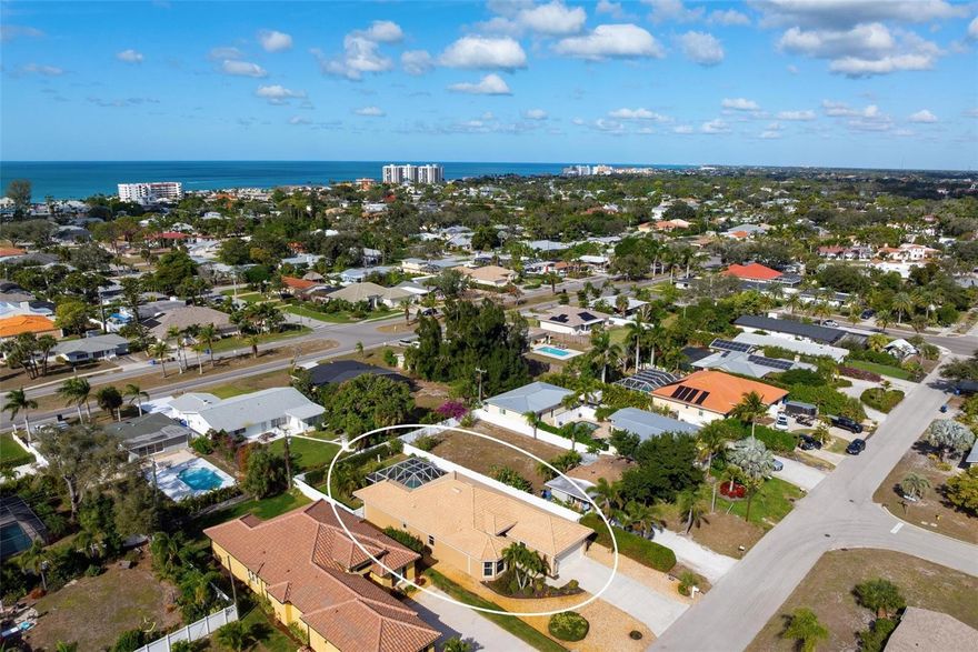 Located on Venice Island just blocks from the blue waters and sandy beaches of the Gulf, this 3-bedroom, 2-bath pool home offers the best of coastal living in a low-risk flood zone and is being offered turnkey furnished. Enjoy a relaxed tropical lifestyle filled with Gulf breezes, where sandy beaches, historic downtown Venice, and even the grocery store are all just a short bike ride away—truly just like home, only at the beach.
Inside, the tiled living area features high ceilings and large-format diagonal-set porcelain tile, creating a bright and open feel. The kitchen is designed for both style and function with staggered white cabinetry, granite countertops, pendant lighting, and a cheerful dinette with banquette seating and an aquarium window overlooking the pool and lanai. The sunlit and spacious primary suite is highlighted by a tray ceiling adorned with intricate stepped moldings, while the primary bath offers dual sinks, granite counters, and a curb-less walk-in shower.
Built by respected local custom builder Schroeder Homes, this residence includes a covered lanai overlooking a caged, free-form heated pool and a beautifully landscaped, fenced yard. Additional features include a private well-fed irrigation system, hurricane shutters throughout, fresh exterior paint, a new AC system in 2020, and a new well pump in 2022—making this an exceptional Venice Island opportunity.