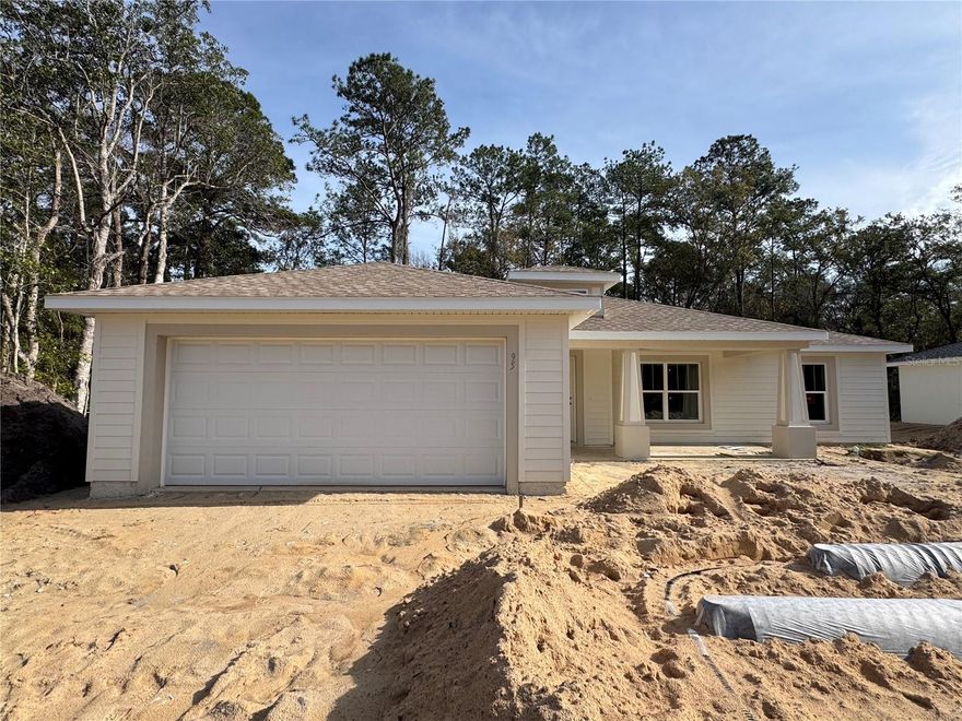 Under Construction. Welcome to your private sanctuary in beautiful Ocala, Florida! This stunning new construction home is a meticulously crafted retreat where Craftsman-style architecture meets modern comfort. Situated on a generous .46-acre lot, this property offers the rare luxury of backing directly up to the Ocala National Forest, providing a seamless and unobstructed connection to nature.

The exterior of the home boasts classic Craftsman character, featuring high-quality siding.  A charming 119-square-foot front porch invites you to relax and take in the fresh air, while the shutters on the front window add a touch of traditional curb appeal that fits perfectly into the serene, wooded landscape.

Step inside to an easy-flowing, open-concept layout where luxurious vinyl plank flooring runs throughout the entire home. The kitchen is designed for both style and functionality, featuring sleek stainless steel appliances and a spacious island that serves as the heart of the home, perfect for casual dining or entertaining. With clean, modern finishes and a bright aesthetic, this space is as practical as it is beautiful.

The spacious master bedroom is your private escape, complete with an elegant tray ceiling and a spa-like en-suite bathroom featuring a beautifully tiled shower. For your convenience, all three bedrooms are equipped with ceiling fans, and every window comes move-in ready with 2-inch blinds for instant privacy.

The outdoor space is truly the star of the show. Enjoy quiet mornings on your 128-square-foot screened-in lanai, where a ceiling fan keeps the breeze moving. Because the home sits on nearly half an acre and remains unfenced to preserve the view, your backyard feels like an endless extension of the lush, protected greenery of the Ocala National Forest. It is the ultimate setting for those seeking peace, seclusion, and a front-row seat to Florida's natural beauty.

This home combines superior quality with an exceptional location. Don’t miss your opportunity to own this unique property—call us today to schedule your showing!