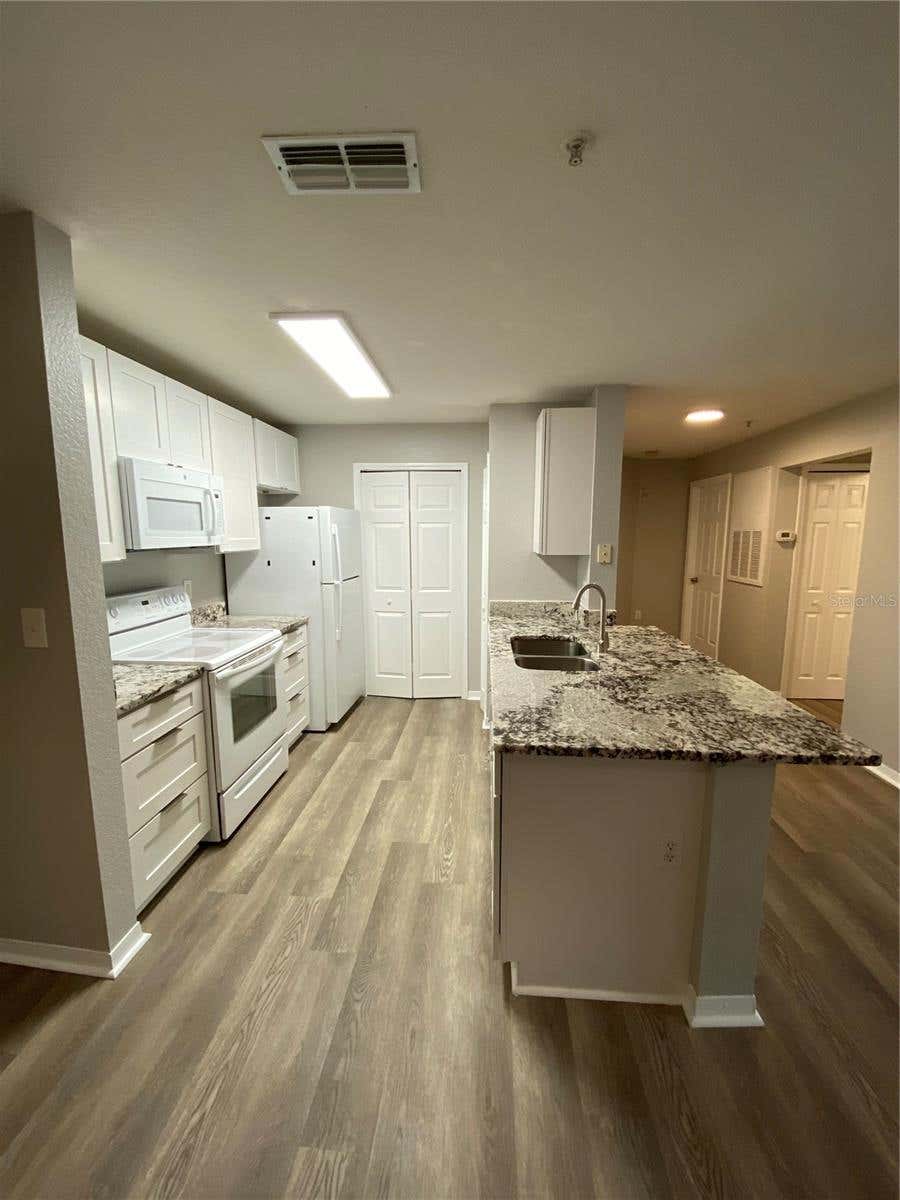 Photo of 5479 Vineland Road #9213, Orlando, FL 32811 (MLS # O6435845)