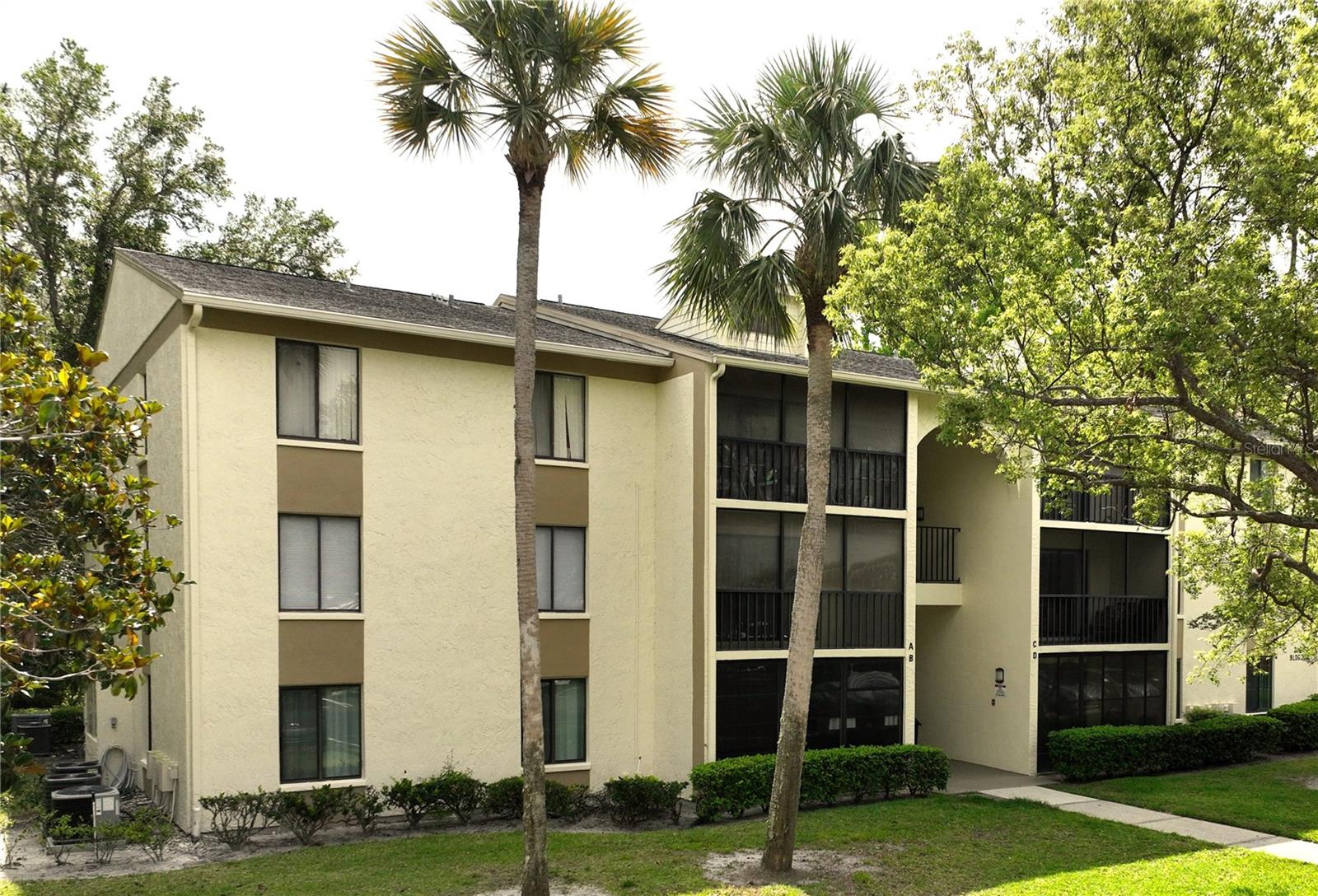 One or more photo(s) has been virtually staged. Welcome to a beautifully updated 2-bedroom, 2-bathroom second-floor condominium in the serene and desirable community of Pine Ridge at Lake Tarpon Village. This turn-key home has been fully remodeled from top to bottom, offering modern elegance and worry-free living. Brand-new AC system and water heater (2025) Freshly installed luxury flooring (2025) and new interior paint (2025). Stunning modern kitchen with wood cabinetry, quartz countertops, and stainless-steel appliances (2025) Spacious, open concept living and dining area with natural light. Generously sized bedrooms with ample closet space. Stylish updated bathrooms with contemporary finishes. Enjoy peaceful surroundings, community pool, tennis courts, clubhouse, paved trail, and a location close to gulf beaches, shopping, dining, and top-rated schools! Don’t miss this rare opportunity to own a fully upgraded condo in a prime Tarpon Springs location! Don't forget to click on the virtual tour.