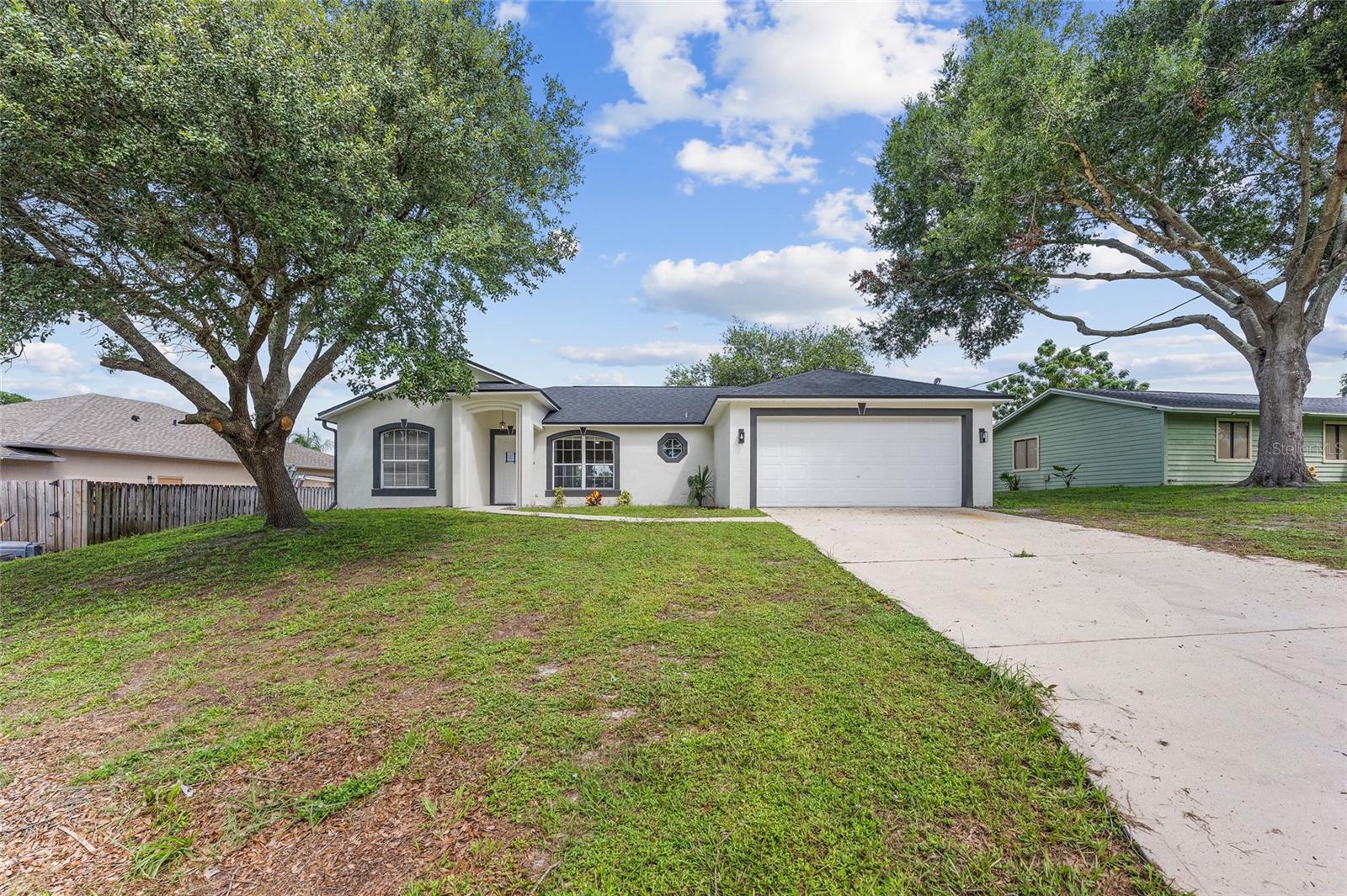 Welcome to this beautifully renovated 3-bedroom, 2-bathroom single-family home with no HOA! Featuring a brand-new kitchen with quartz countertops, new appliances, and a spacious island, this home is perfect for entertaining. Both bathrooms have been fully renovated with new vanities, countertops, and modern fixtures. Freshly painted inside and out, with new LVP flooring and baseboards throughout. The house has been upgraded which includes a brand-new shingle roof, new AC system, and new water heater for peace of mind. The front and backyard have been refreshed and well maintained, providing great curb appeal and outdoor enjoyment. Move-in ready and conveniently located—this home truly has it all!