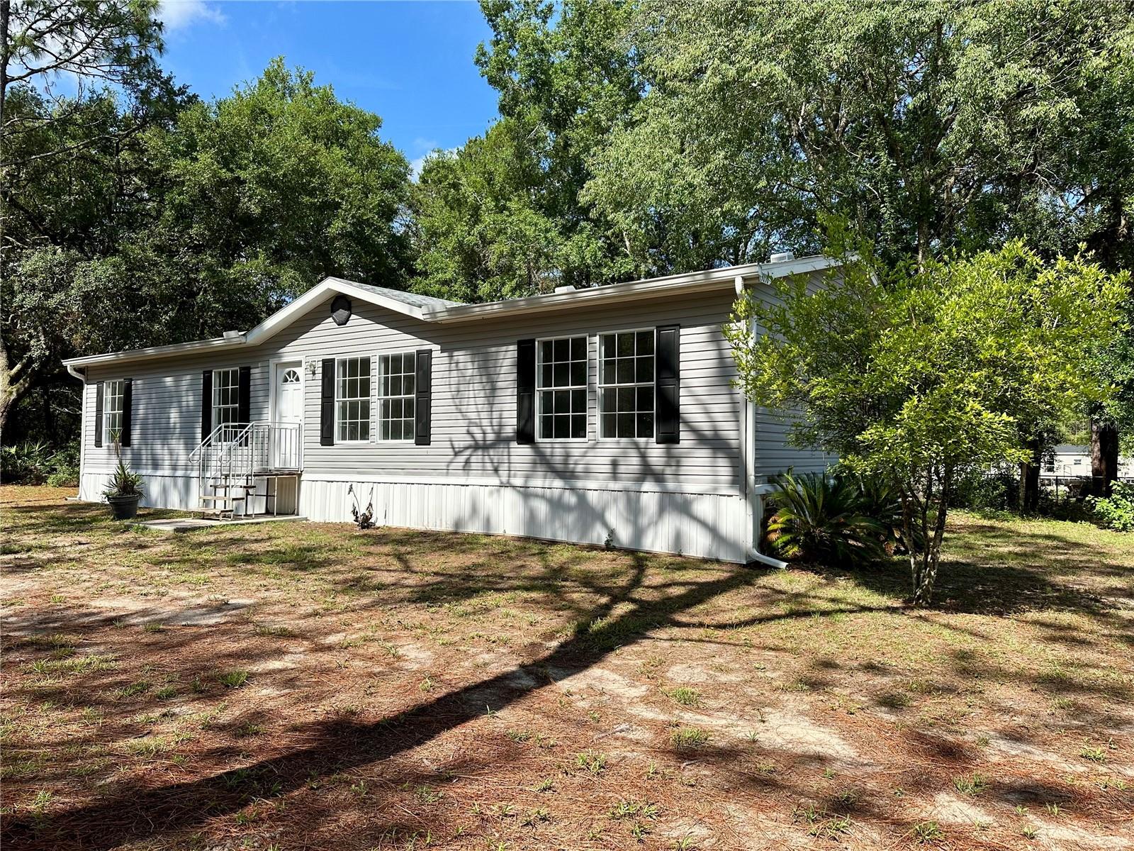 Welcome to this beautifully updated 3-bedroom, 2-bathroom double-wide mobile home offering 1,512 square feet of modern comfort and style. Situated in a peaceful country setting with convenient access to nearby amenities, this home has been fully renovated inside and out.
Recent Upgrades Include:
New roof (2023) and new A/C system (2023) for worry-free living
New skirting for added curb appeal and protection
Luxury vinyl plank flooring and new carpeting throughout
Large 36” x 60” storm windows with screens—bright, airy, and energy-efficient
Adjustable surface-mounted LED ceiling lights with individual dimming options
Brand new kitchen appliances: refrigerator, stove, microwave, and dishwasher
Enjoy cozy evenings by the wood-burning fireplace, equipped with a blower system to circulate warmth throughout the home.
Whether you're looking to escape the hustle of the city or settle into a more relaxed lifestyle, this property offers the best of both worlds—quiet country living with easy access to local stores, parks, lakes, trails, and neighboring towns.