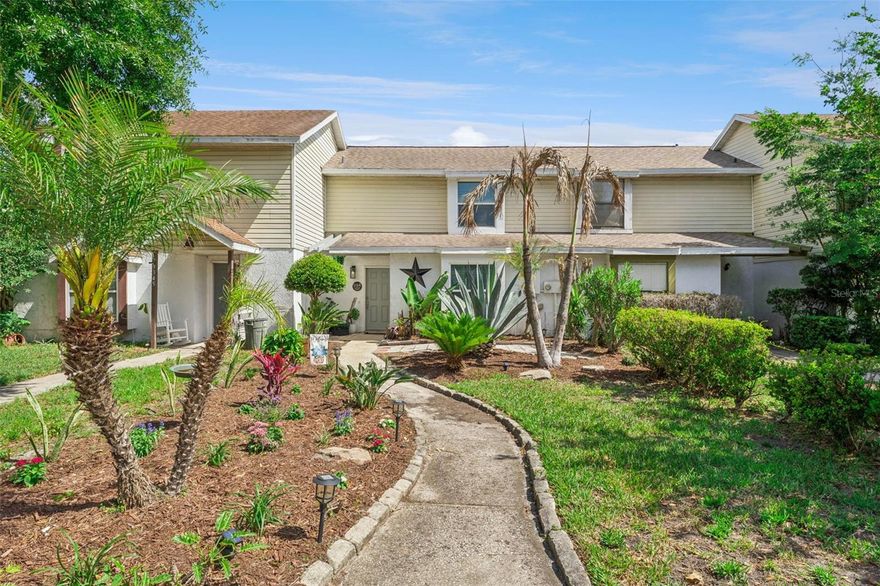 Welcome to your new home! This beautifully maintained 2 bedroom, 2 bathroom townhome in Gotha’s Citrus Oaks community offers comfort, convenience, and thoughtful upgrades throughout. A manicured front lawn, maintained by the HOA with an automatic sprinkler system, creates a welcoming first impression and sets the tone for the care you’ll find inside. As you enter, a secondary bedroom is conveniently located on the main level, ideal for guests, multi-generational living, or a private home office. The hallway opens into a bright, open-concept living, dining, and kitchen space where high ceilings and natural light create an inviting atmosphere for both everyday living and entertaining. The kitchen has been tastefully updated with stainless steel appliances, granite countertops, a stylish backsplash, and ample workspace to handle meals of any size with ease. Overlooking the main living area, it’s designed to keep everything connected and functional. Upstairs, a unique loft-style hallway overlooks the living space below, adding an airy, open feel throughout the home. The primary suite is tucked away upstairs, offering a spacious retreat complete with a large closet and a beautifully appointed en suite bath. Step outside to enjoy Florida living at its best. A screened-in patio provides a comfortable space to relax without the pests, while the recently added paver patio offers a perfect spot to soak up the sunshine or entertain outdoors. A small fenced yard adds an extra layer of privacy and is great for small four legged friends or play. This home has been extensively updated for peace of mind, including new windows and sliding door (2025), a new upstairs bathtub (2025), water heater (2024), AC unit (2024), upgraded wiring (2025), new flooring (2024), and enhanced storage solutions throughout. Located with easy access to the 408, Florida Turnpike, and FL-429, commuting feels effortless from this home. You’re also just minutes from great restaurants, shopping, and schools, and less than 25 minutes to Universal Studios, Walt Disney World, and downtown Orlando, with Orlando International Airport under 30 minutes away. Everything you need is right at your fingertips in a prime location, don't wait out on this amazing property. Schedule a private showing TODAY!!!