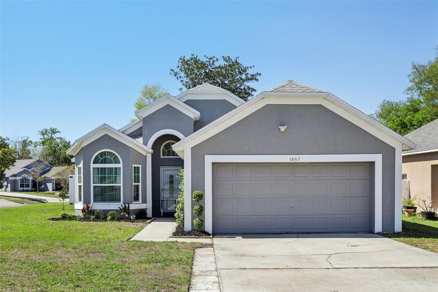 Welcome to 1867 Piedmont Park Blvd, a beautifully upgraded pool home in the heart of Apopka offering modern improvements, flexible living, and built-in income potential. Originally renovated and known for its open concept layout, private pool, and spacious fenced yard, this home has since undergone extensive additional upgrades that truly set it apart. Major system updates have already been completed, including a newer roof (2022), AC installed 2023, updated plumbing, new ductwork, and added insulation, providing efficiency, comfort, and peace of mind for years to come. The home also features new windows under warranty and a generator plug already installed. Inside, the home has been thoughtfully redesigned with a new front door and storm door, updated baseboards and trim, and modern fixtures throughout. The layout offers both functionality and versatility with custom built closets, a dedicated linen area, and additional storage, including attic access with reinforced flooring and installed stairs. The primary suite has been upgraded with new flooring (2024) and a reimagined bathroom featuring double sinks, a dedicated vanity space, a new shower window, and expanded cabinetry. Secondary bedrooms are equally impressive, including a walk in closet in bedroom two and a multi-functional third bedroom complete with a Murphy bed, built-ins, and walk-in closet, ideal for guests, a home office, or flex space. The living and dining areas flow seamlessly, enhanced by a newly added wall and brand new windows in the informal dining space, bringing in natural light while creating a more defined and inviting environment. Step outside to your private backyard retreat featuring a fully fenced yard and a saltwater pool with a new pump and filter (2024), approximately 7 feet deep, perfect for entertaining or relaxing. Additional exterior upgrades include new French doors leading to the patio and a full fencing replacement for added privacy. The home also includes a current transferable termite bond with Orkin. Located in the quiet and established Piedmont Park community with convenient access to 414, this property offers a unique combination of upgrades, lifestyle, and income potential. Just around the corner, you’ll find a neighborhood park, perfect for enjoying the outdoors, walking, or spending time with family. This is a must see.