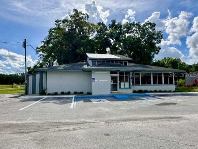 COMMERCIAL OPPORTUNITY! This building boasts over 2,600 square feet of interior, air conditioned space and sits directly on US HWY 129 (Main St). High traffic count! Paved parking lot. Walking distance to other local businesses and schools. This building can accommodate a wide range of commercial needs and is just waiting on your new business venture! This location is ideal for a variety of business types such as, RETAIL- grocery or drug store, boutique or florists, SERVICE - salon/wellness studio, daycare or tutoring center, dry cleaners/laundromat, PROFESSIONAL - law office, insurance agency, tax prep services, medical office, etc. Formerly used as a restaurant. The possibilities are endless! Bring your ideas to life in this rural community of Bell, FL! Gilchrist County is known for its low taxes, "A" rated schools, crystal clear springs, and famous rivers.