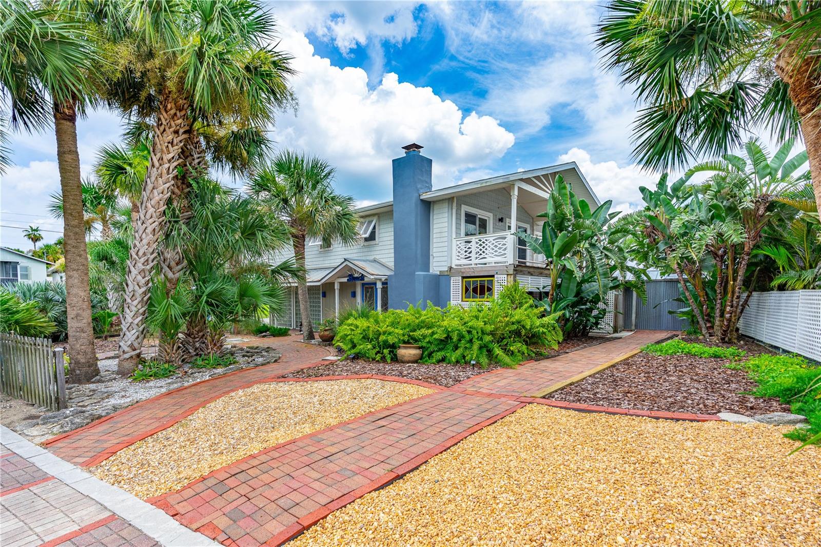 Welcome to this one-of-a-kind beachside home in Wilbur-by-the-Sea—where life moves at the pace of ocean breezes and sunset strolls. Set on a lush, oversized lot, this vibrant two-story beach home offers 3 bedrooms, 2 baths, 2 car garage and room for your toys. Step through colorful stained-glass doors into the cozy lower level, featuring a family room with fireplace, a bedroom, full bath, and a bonus flex space—ideal for a home office or creative studio. Also, a dedicated laundry room with sink. Take either of the two staircases to the upper level, where you'll find an open living room, newer hurricane slider doors , custom kitchen, a primary suite w/ walk-in closet and private balcony. The second bedroom features a built-in bed and desk, while an oversized flex room is ready for your imagination. Outside, enjoy covered porches, and multiple outdoor hangout spots for soaking up the salt air. Just steps from beach access, you can dip your toes in the ocean any time
And don't miss the short proximity from the Wilbur Boathouse, where neighbors gather for kayaking and evening monthly potlucks.
All measurements and information deemed accurate but not guaranteed. Buyers and agents to verify.