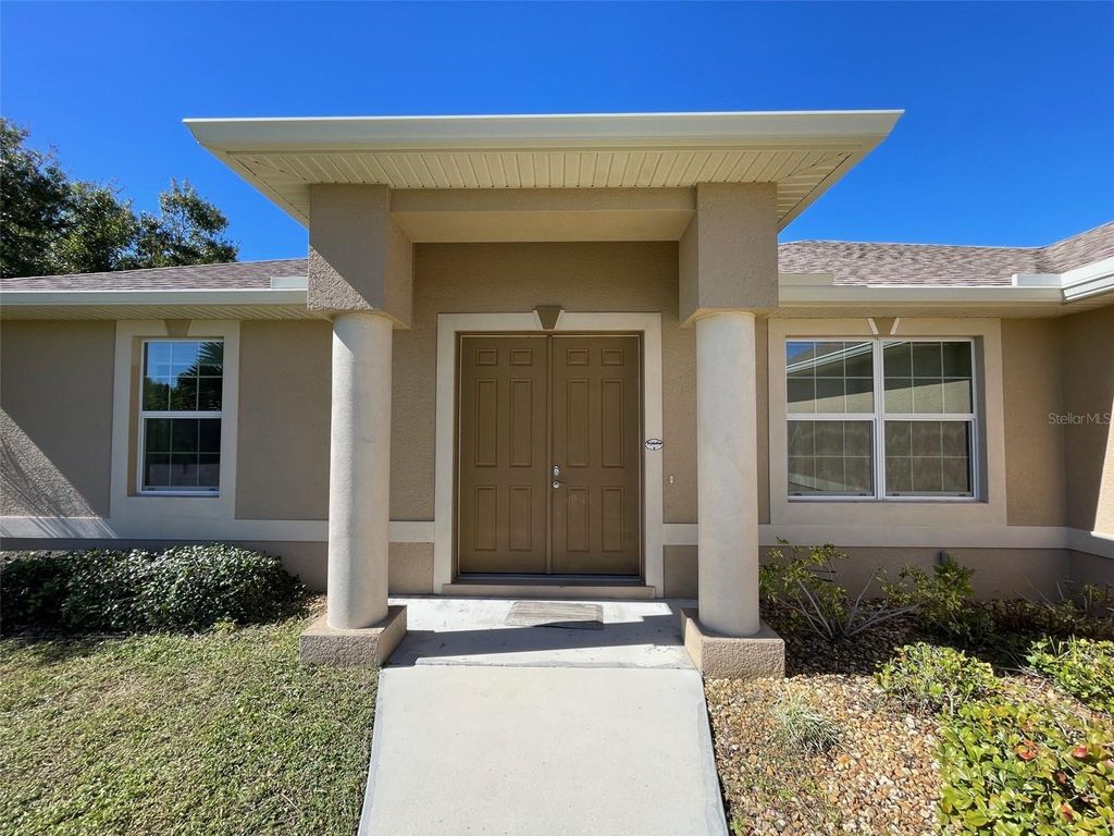 Photo of 497 Macarthur Drive, Port Charlotte, FL 33954 (MLS # C7515790)