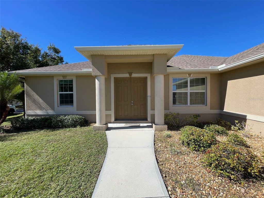 Photo of 497 Macarthur Drive, Port Charlotte, FL 33954 (MLS # C7515790)