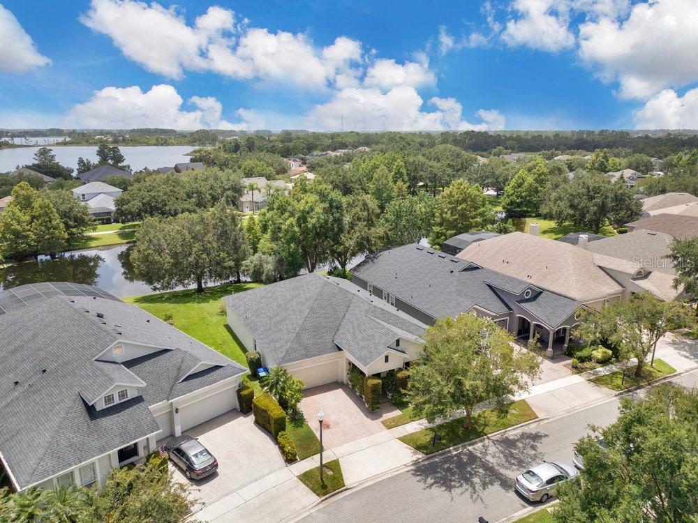 Here is your chance to own this spacious well-maintained one-story 4-bedroom waterfront home on a pond located in the desirable Providence neighborhood of Windermere. As you enter through the front porch and foyer you will immediately notice the high 10’ ceilings and inviting rooms to your well-thought-out floor plan. The living room is spacious with an elegant dining room overlooking the screened in lanai. The kitchen is fully equipped with wood cabinetry, solid countertops, Whirlpool appliances, and a breakfast nook with unobstructed water views. Your primary suite is large and well-appointed with access to the lanai including a walk-in closet, dual vanities, tub, and separate shower. Secondary bedrooms have plenty of closet space and conveniently located next to the full bathroom. The screened in covered lanai encompasses the Florida lifestyle for those endless summer barbeques and memorable get togethers. It is a plus having no neighbors in the rear with serene water views! Notable upgrades include a newer roof installed in 2020. The neighborhood features its own playground, swimming pool, and gazebo. Additionally, Providence is 10 minutes to Disney World, across the street to Aldi and popular restaurants, 30 minutes to the international airport, and zoned for great schools including Windermere Elementary, Bridgewater Middle, and the newer Windermere High School. Don’t miss out on this extraordinary home! Be sure to click on the virtual tour link.