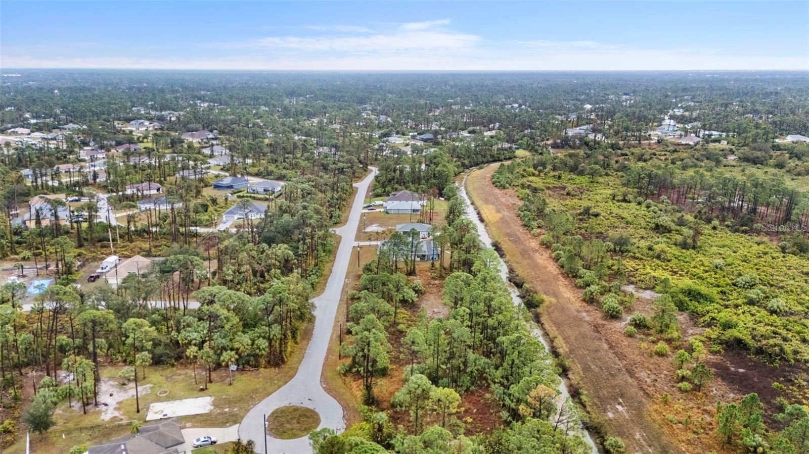 Get lender financing for about 4,000 down and about 265.00 a month payment. This beautiful freshwater canal lot is located in a desirable area of North Port, surrounded by lovely homes. There are no HOA or CDD fees. The adjacent lot may also be available for purchase from a separate owner, offering the opportunity to combine for a spacious double lot. North Port is seeing significant growth and is a popular destination for those relocating. Conveniently located just minutes from shopping, dining, and other amenities. Whether you’re looking to build now or hold as a future investment, this lot offers great potential.