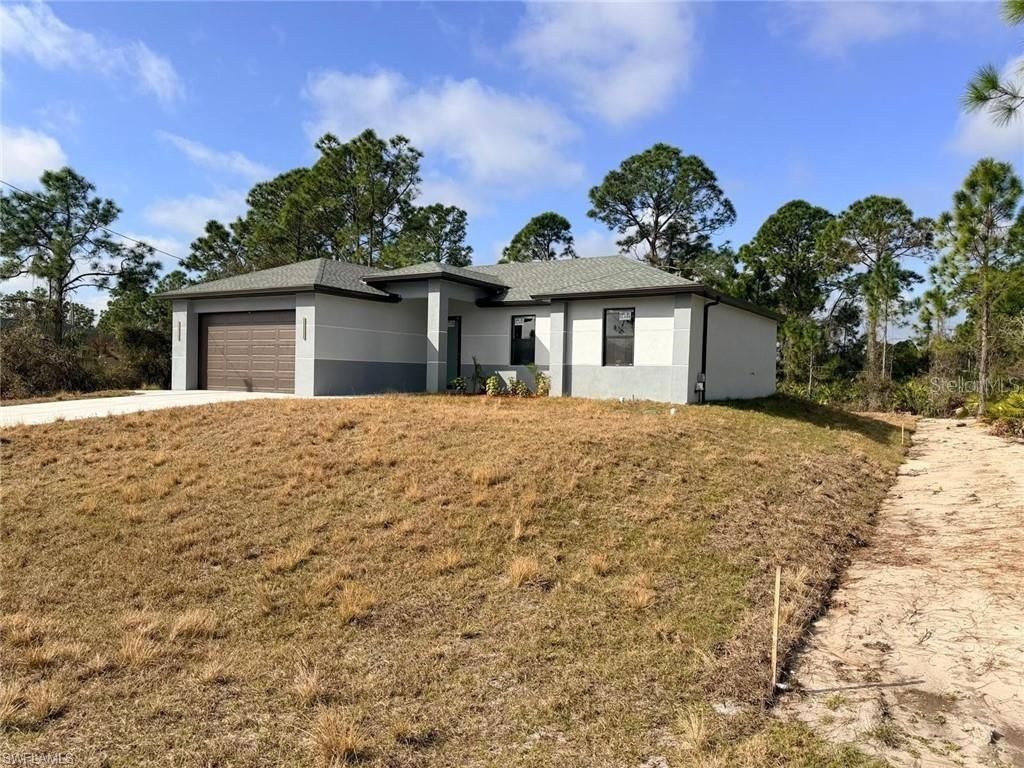 Photo of 724 Drury Avenue, Lehigh Acres, FL 33974 (MLS # A4686080)