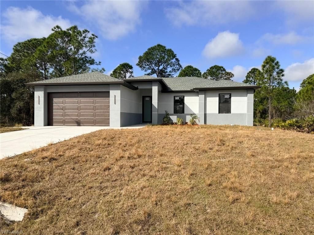 Photo of 724 Drury Avenue, Lehigh Acres, FL 33974 (MLS # A4686080)