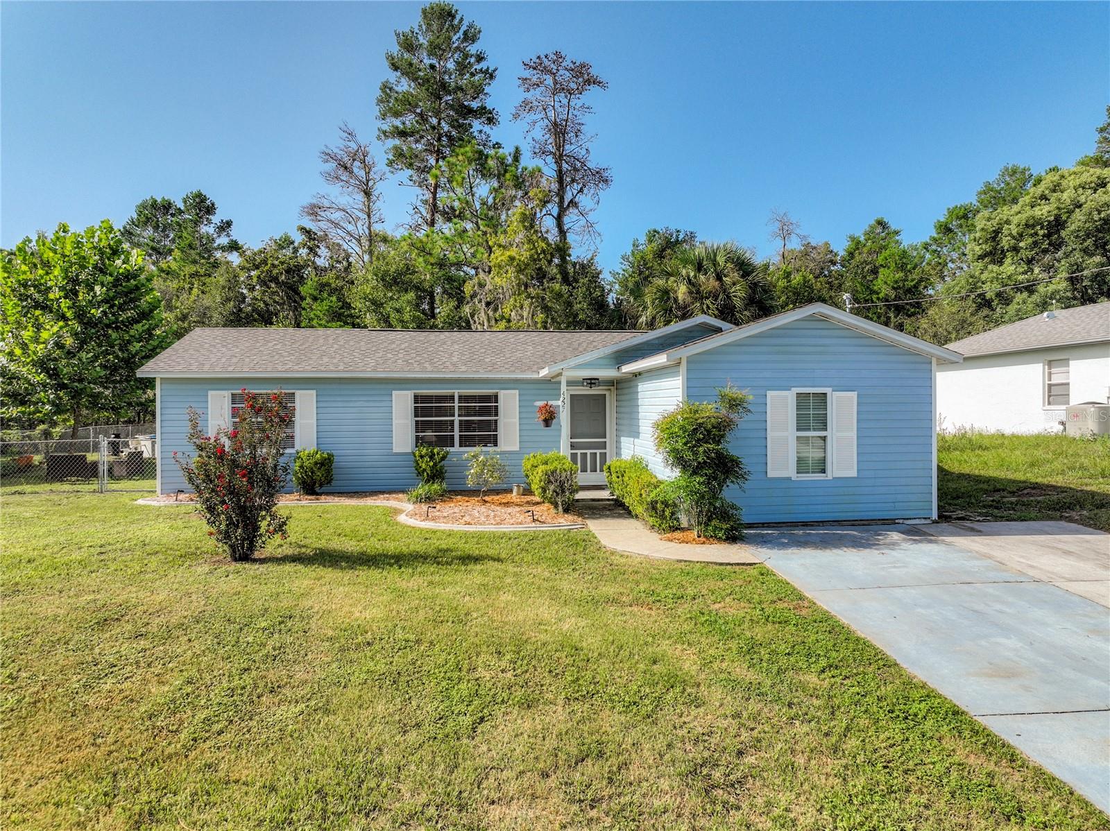 Stylish and adorable describes this 2-bedroom, 2-bath home located in the desirable Spring Hill area. This home offers a garage conversion and is currently being used as a 3rd bedroom (with heat and air) totaling 1428 sq ft. The spacious open floor plan features a welcoming living room/dining room combo and a separate family room/sitting room or office. The kitchen has been updated with new white cabinets, Formica counters, dishwasher, sink and offers a closet pantry. You’ll find ample space in the master bedroom and the master bath. The 2nd & 3rd bedrooms are also spacious in size. There is a dedicated laundry room with a new washer & dryer. No garage, that’s ok, there is a shed included. Imagine stepping out back to a fully fenced yard to enjoy gorgeous sunsets, enjoy your morning coffee or watch the kids play on the swing set/play structure or cool off in your above ground pool. The property behind is zoned agricultural so you can enjoy watching the cows and horses graze in the field or even come up to the fence. Other features include reroof in 2022, AC 2019, water heater 2019, drain field 2023, BRAND NEW ELECTRICAL PANEL SCHEDULED FOR 9/26/23, new laminate flooring, new front door to be installed prior to closing, and a new shower in the primary bath. NO HOA, NO CDD!! Veterans Memorial Park, and Anderson Snow Park, popular for its sports complex and play area are less than 5 miles away. Crews Lake Park, known for its beautiful camping sites and picturesque scenery is just minutes away. Lots of shopping and local favorite dining options nearby. Minutes to the famous Weeki Wachee live mermaids, Pine Island Park and Roger’s Park for fun on the water. Close to the Suncoast parkway for quick access to the airport, Tampa, Clearwater and St. Pete Beaches (Ranked in the top 5 Beaches in the US), also close to the famous Tarpon Springs Sponge Docks. Lots of shopping and local favorite dining options.