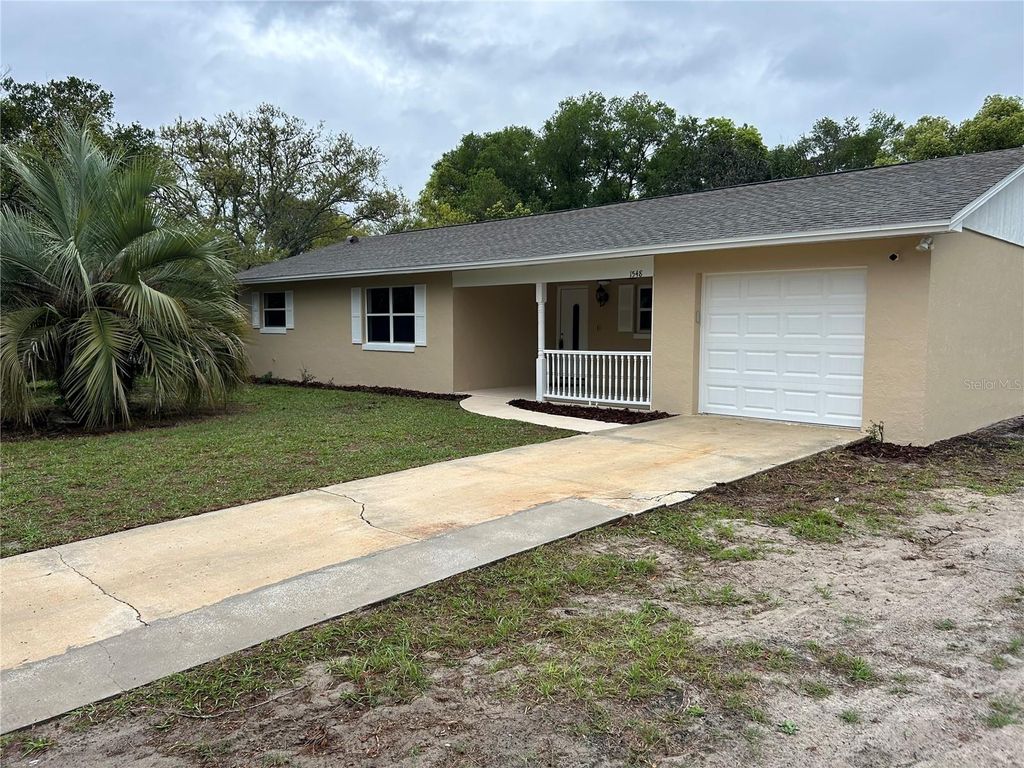 Photo of 1548 Baltimore Avenue, Deltona, FL 32725 (MLS # V4948387)