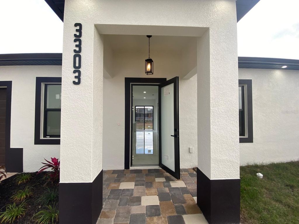 Photo of 3303 13th Street W, Lehigh Acres, FL 33971 (MLS # TB8374707)