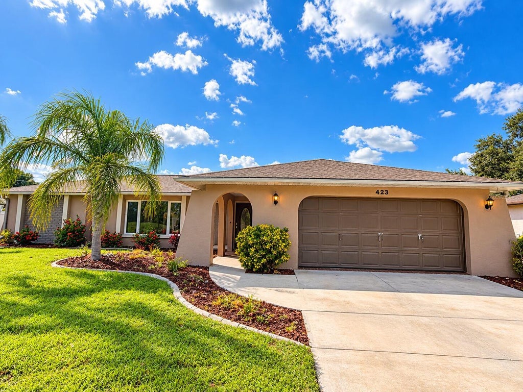 Photo of 423 Waterside Street, Port Charlotte, FL 33954 (MLS # O6451924)