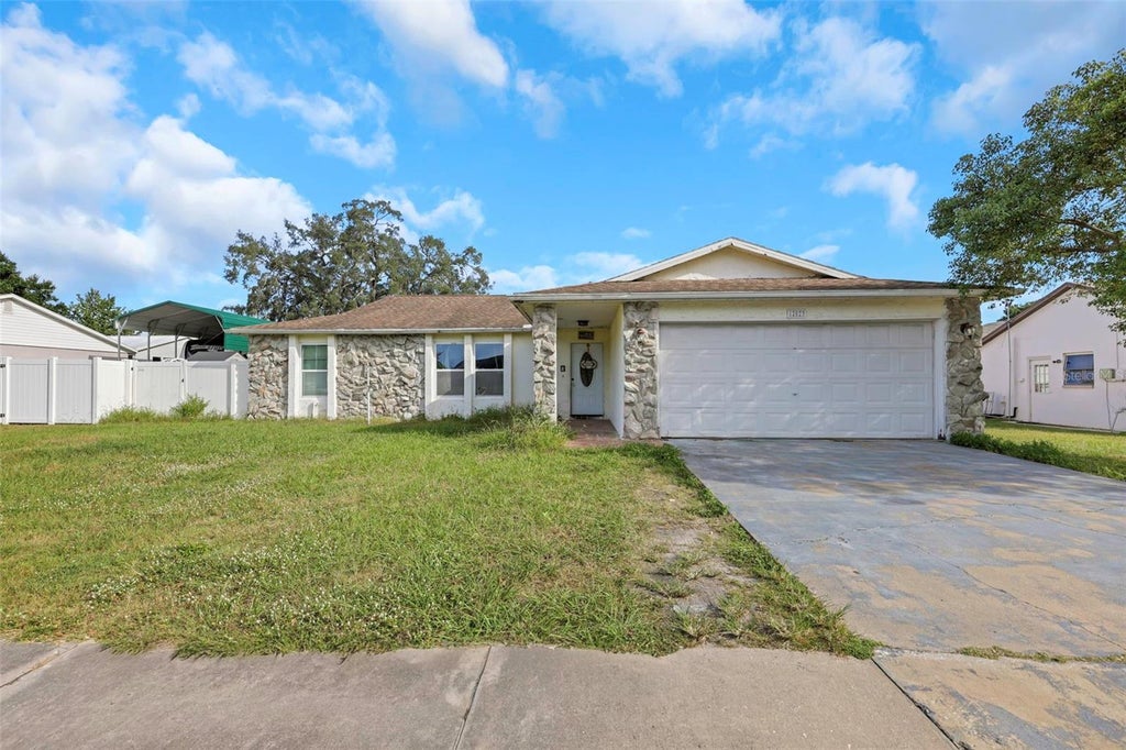 Photo of 12023 Mahogany Drive, Hudson, FL 34669 (MLS # O6447011)